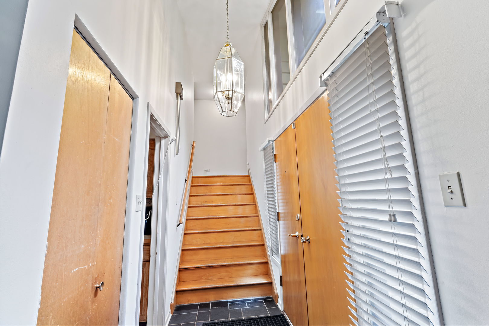 18807 Delta Road Homewood, IL 60430 - Photo 2 of 16 a view of a hallway with wooden floor and staircase
