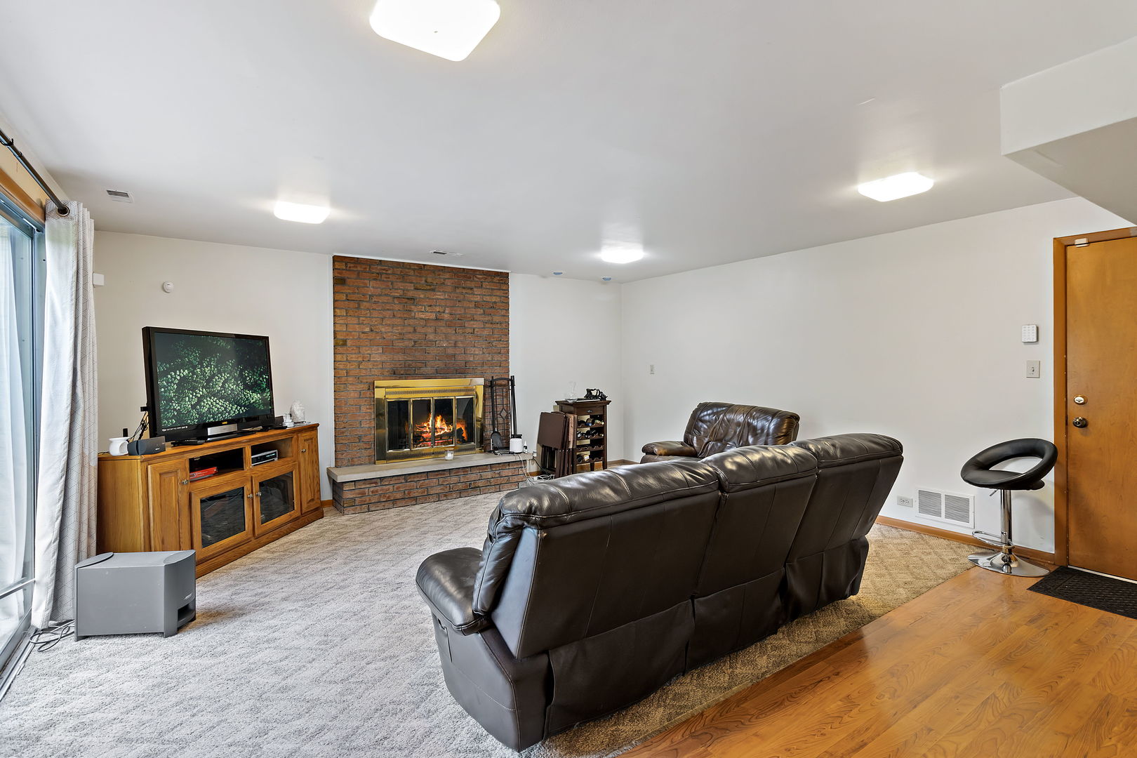 18807 Delta Road Homewood, IL 60430 - Photo 7 of 16 a living room with furniture and a flat screen tv