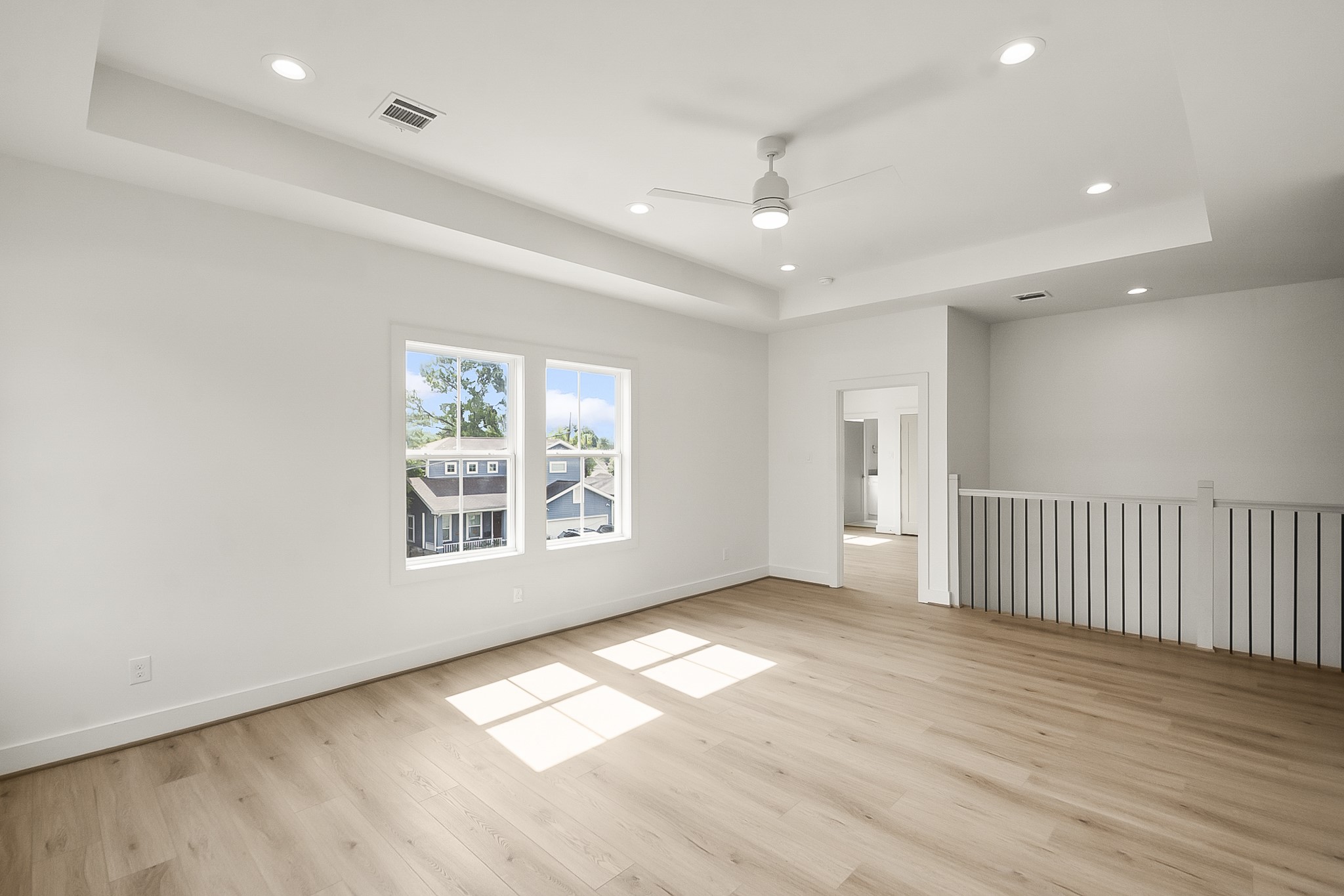1109 Tabor Street Houston, TX 77009 - Photo 29 of 38 an empty room with wooden floor and windows