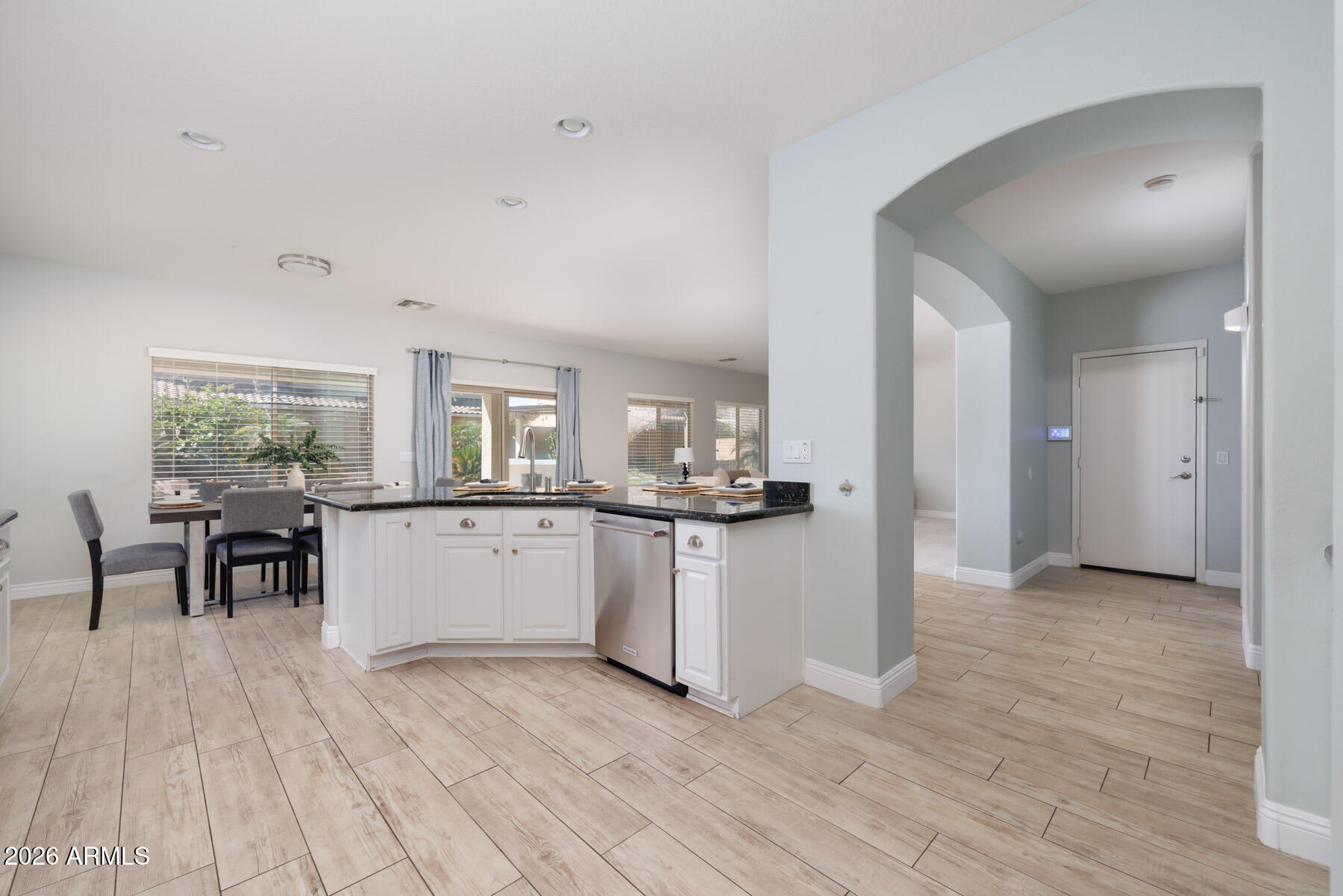 3167 East Powell Way Gilbert, AZ 85298 - Photo 10 of 39 a kitchen with stainless steel appliances granite countertop a refrigerator and a stove top oven