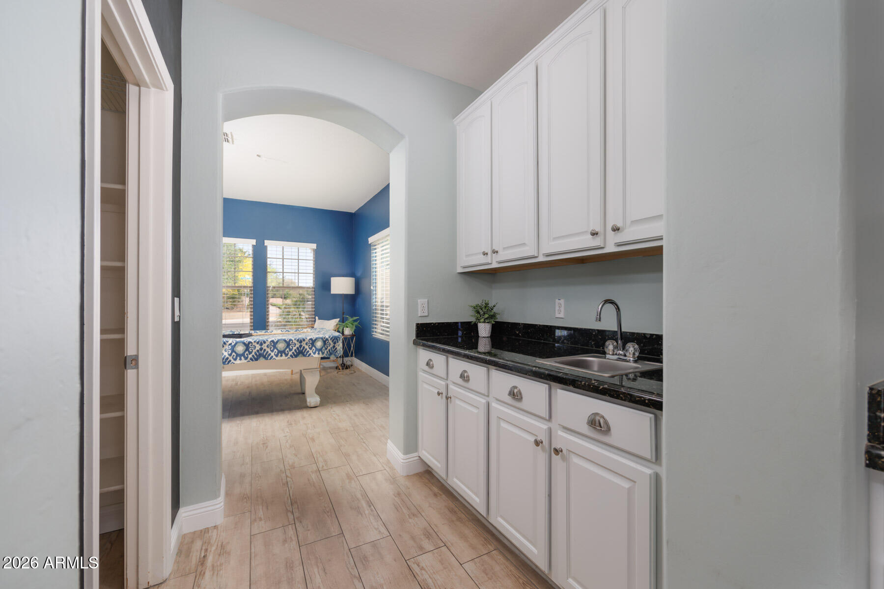 3167 East Powell Way Gilbert, AZ 85298 - Photo 11 of 39 a kitchen with granite countertop a sink and cabinets
