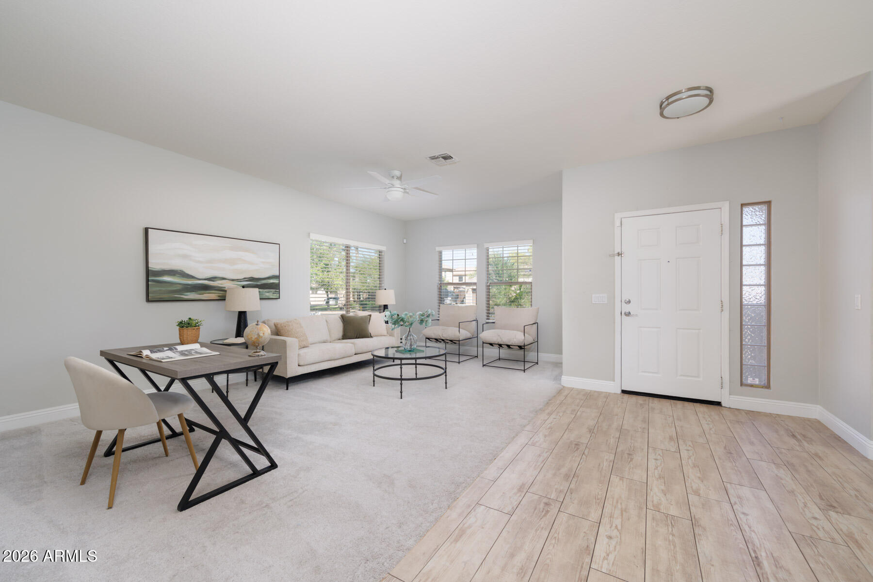 3167 East Powell Way Gilbert, AZ 85298 - Photo 13 of 39 a view of a livingroom with furniture and wooden floor