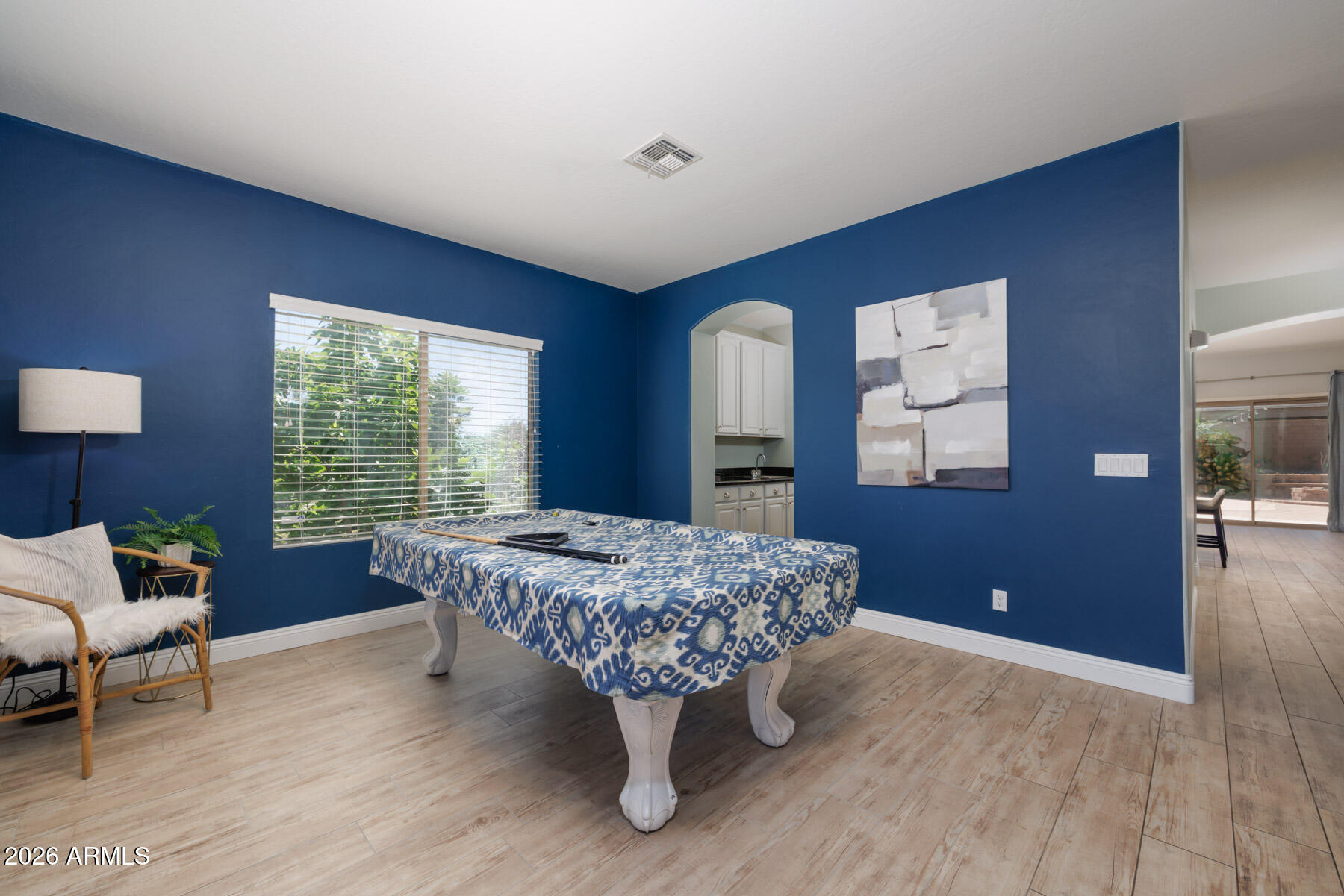 3167 East Powell Way Gilbert, AZ 85298 - Photo 15 of 39 a bed room with a bed and a chair