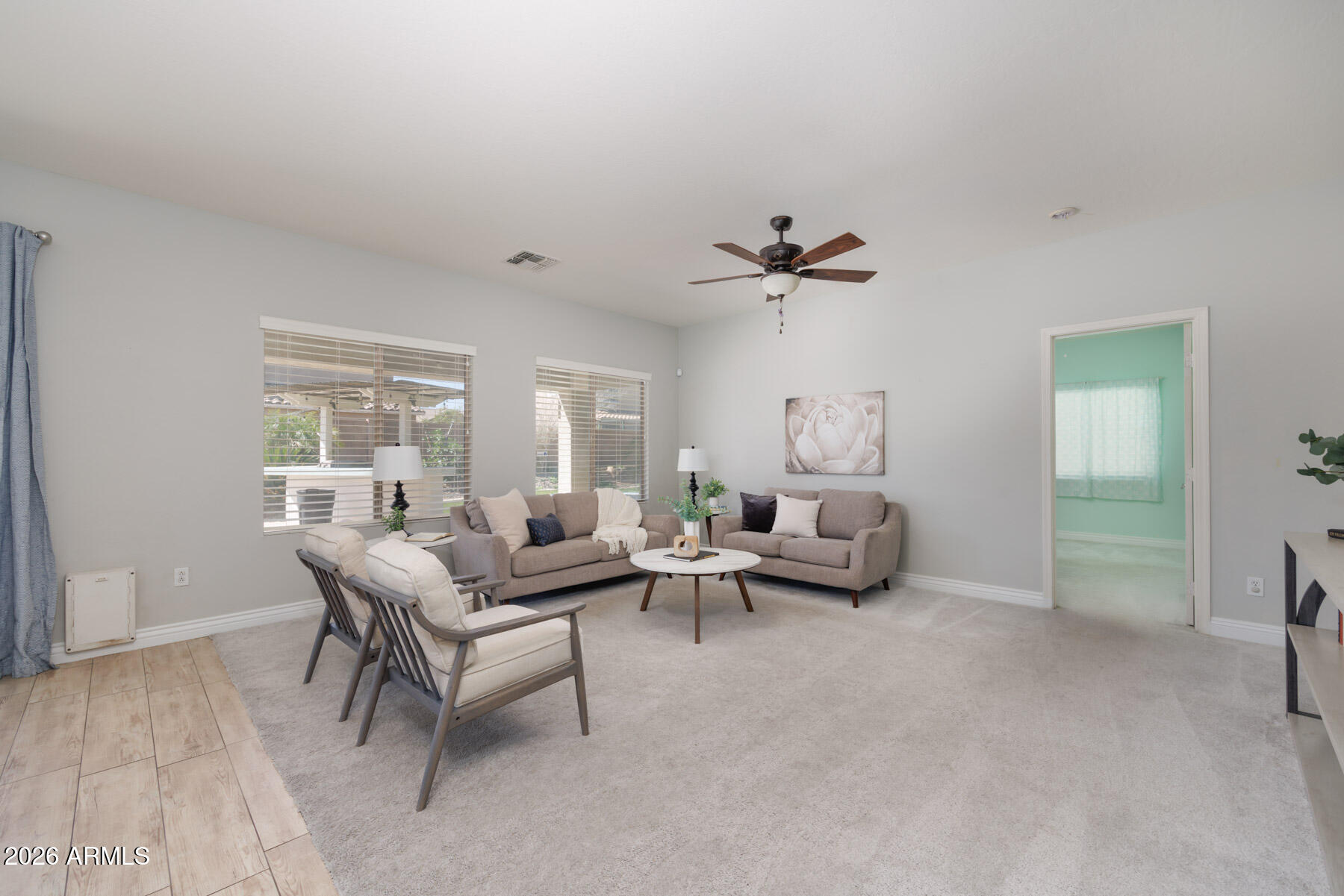 3167 East Powell Way Gilbert, AZ 85298 - Photo 16 of 39 a living room with furniture and a large window