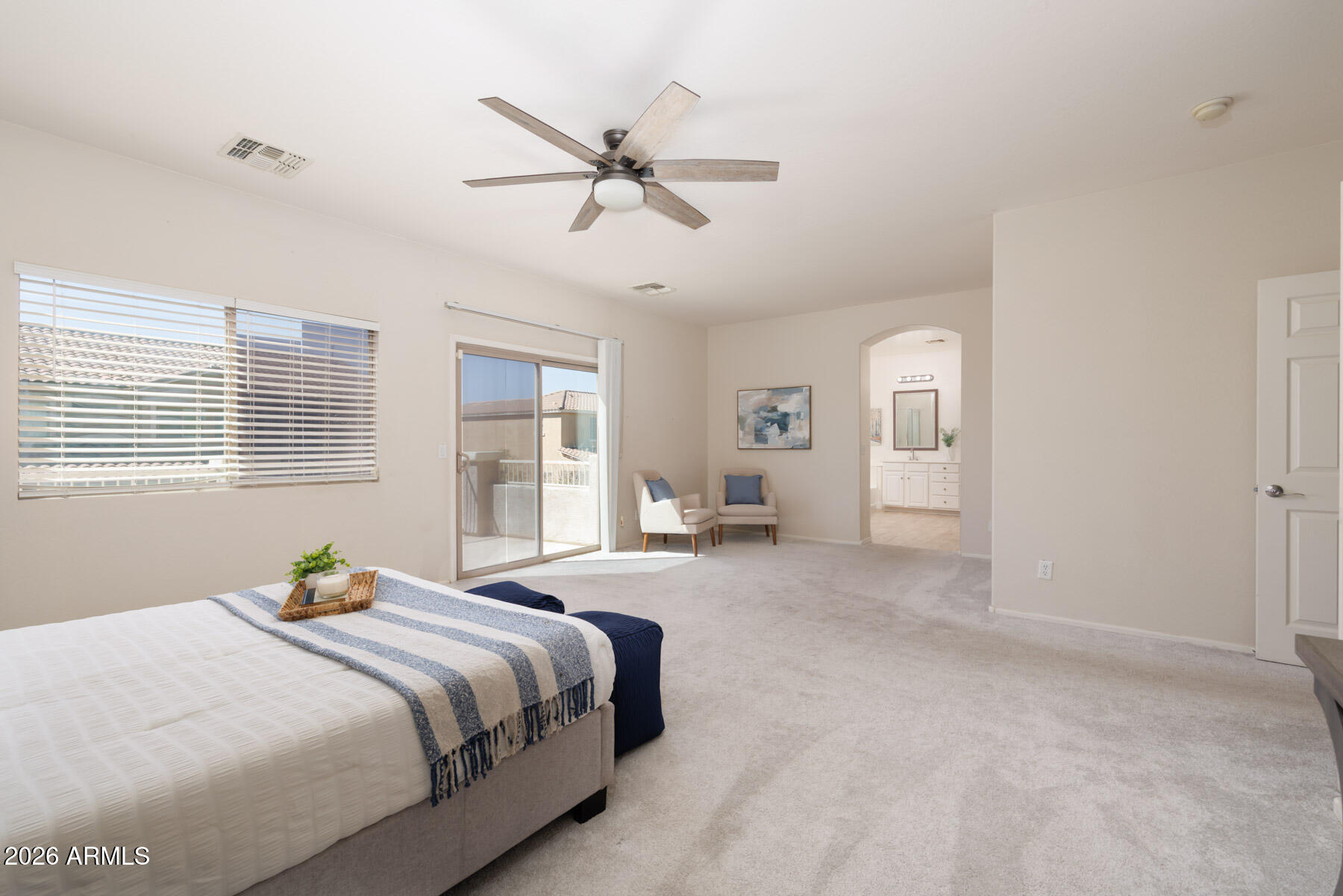 3167 East Powell Way Gilbert, AZ 85298 - Photo 20 of 39 a spacious bedroom with a bed and closet