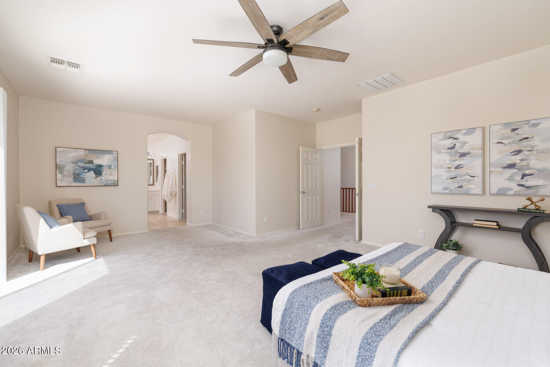 3167 East Powell Way Gilbert, AZ 85298 - Photo 21 of 39 a bedroom with a bed and a chandelier