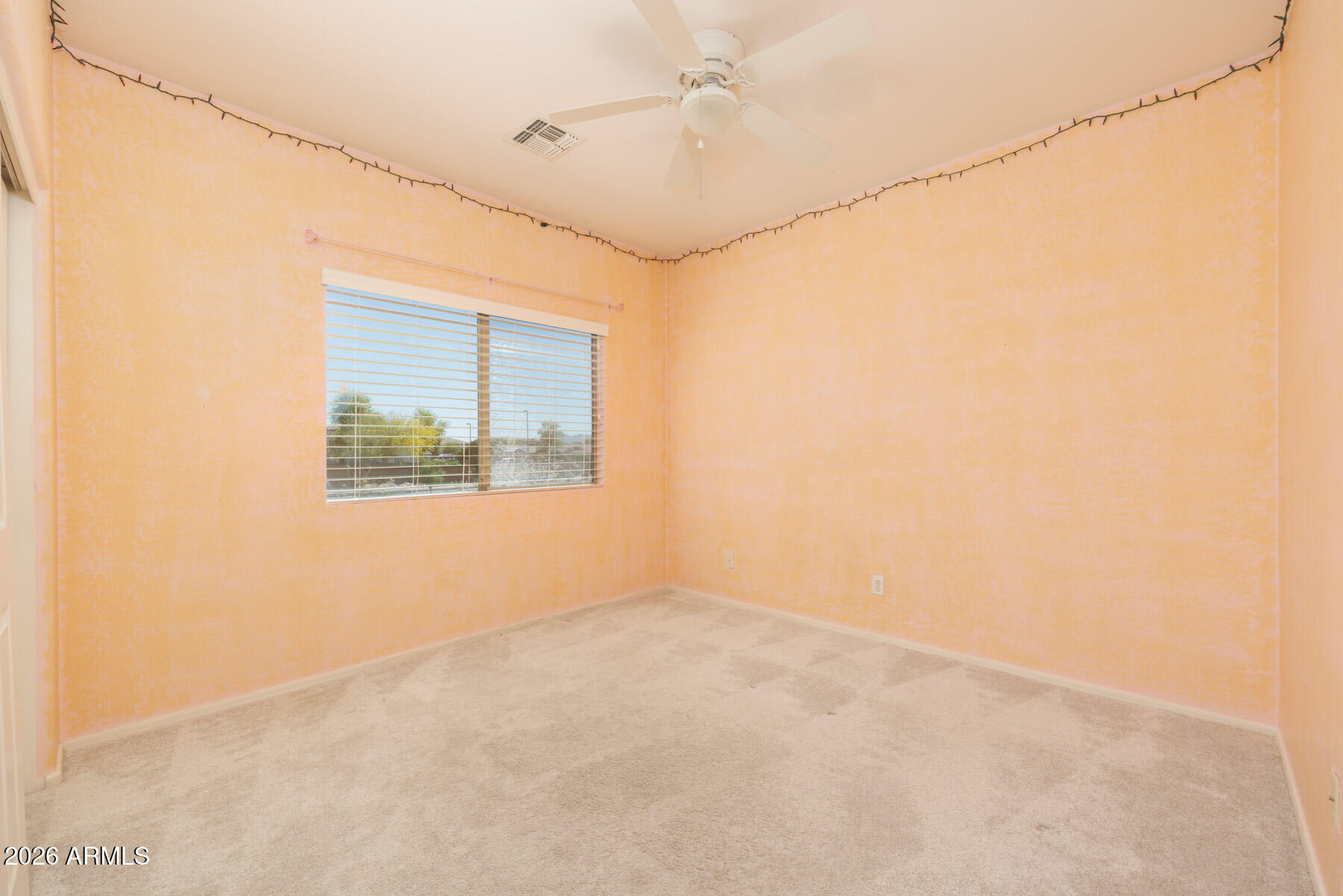 3167 East Powell Way Gilbert, AZ 85298 - Photo 23 of 39 an empty room with windows and fan