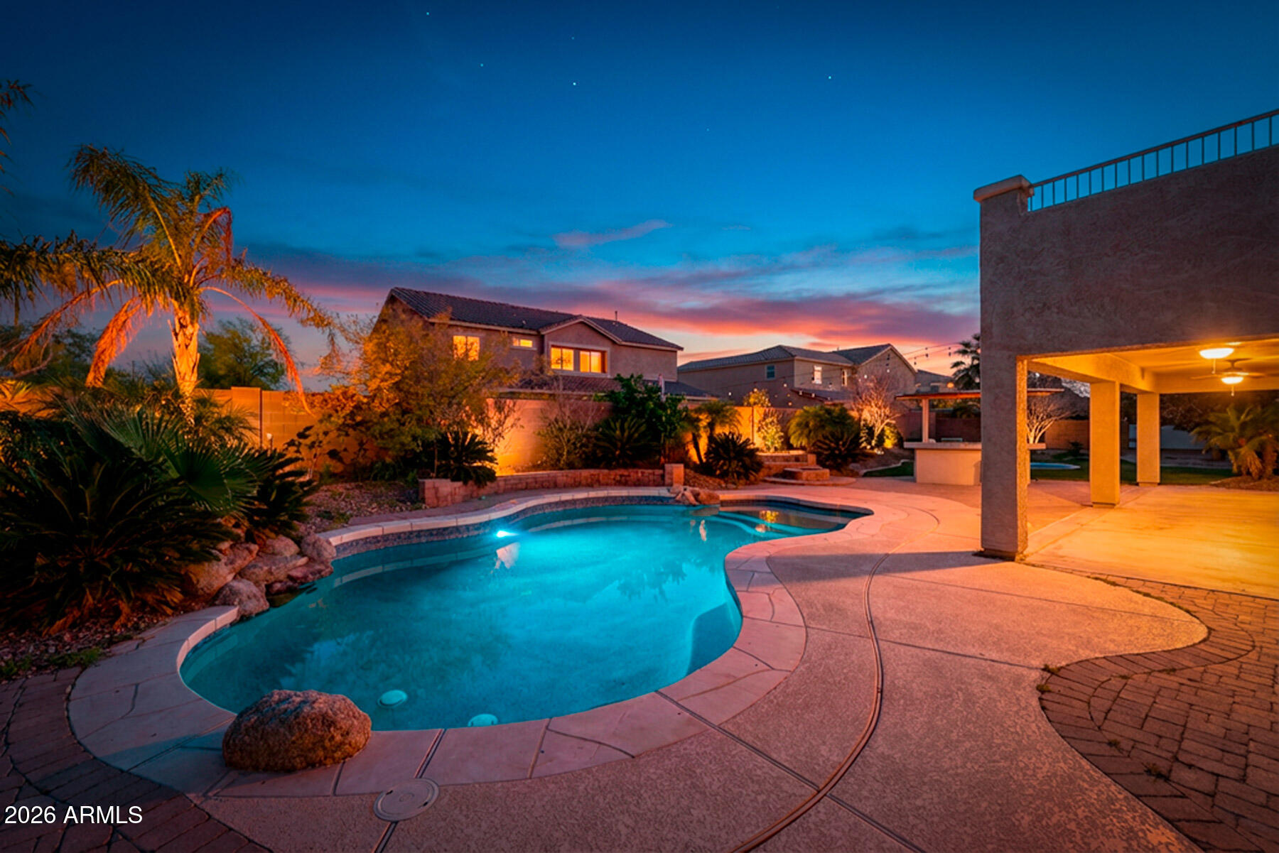 3167 East Powell Way Gilbert, AZ 85298 - Photo 2 of 39 a view of a swimming pool with an outdoor space and seating area