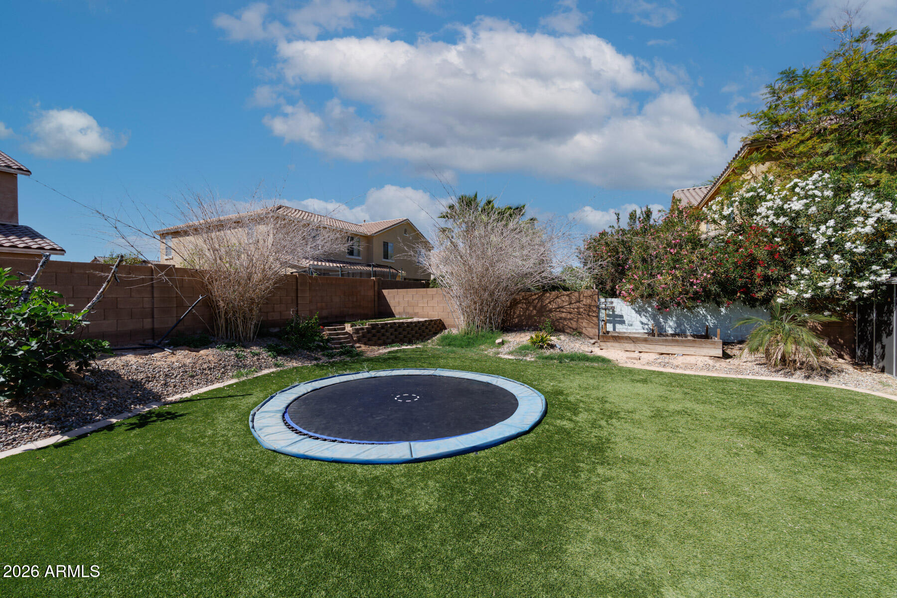 3167 East Powell Way Gilbert, AZ 85298 - Photo 36 of 39 a view of a swimming pool with a yard