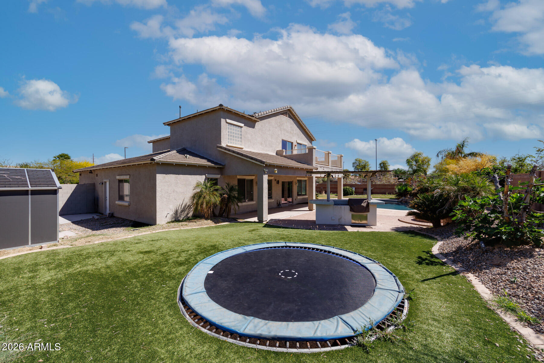 3167 East Powell Way Gilbert, AZ 85298 - Photo 37 of 39 a view of a house with a backyard porch and sitting area