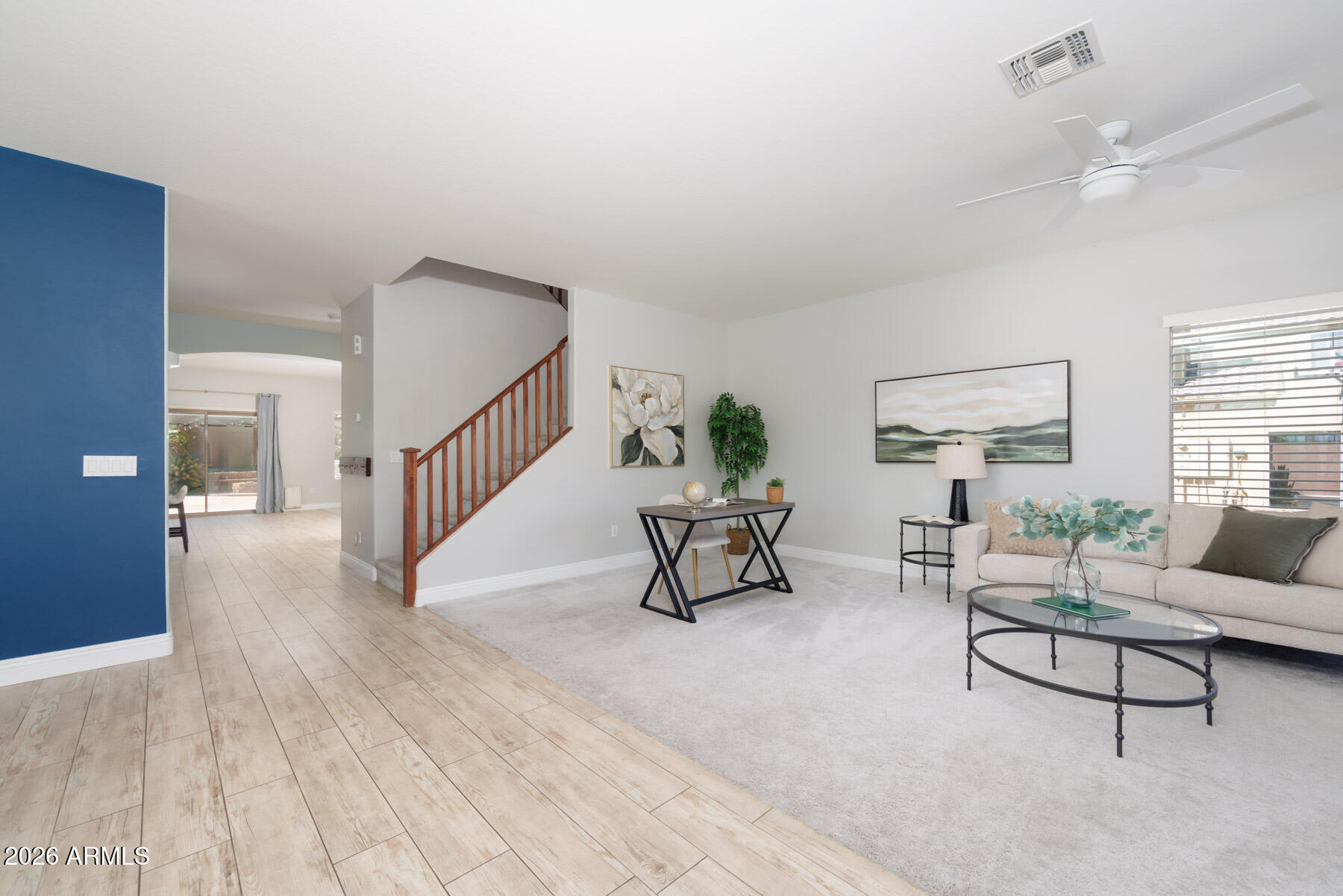 3167 East Powell Way Gilbert, AZ 85298 - Photo 7 of 39 a living room with furniture and a table