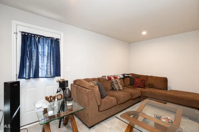 a living room with furniture and a couch