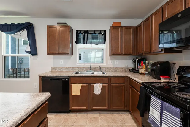 a kitchen with a stove and a sink