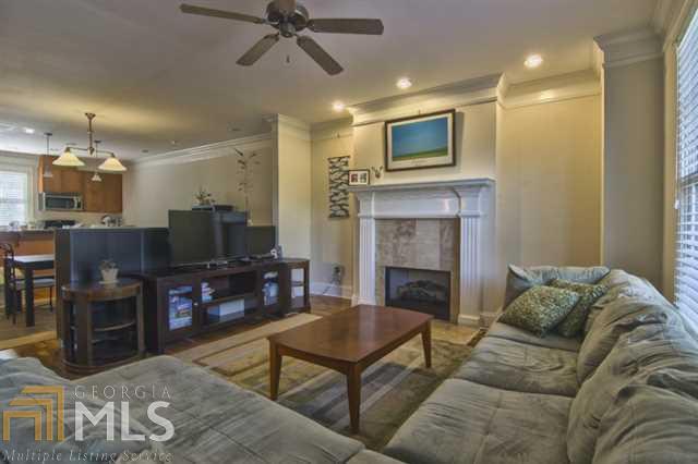 104 Knob Hills Circle Decatur, GA 30030 - Photo 1 of 1 a living room with furniture a flat screen tv and a fireplace