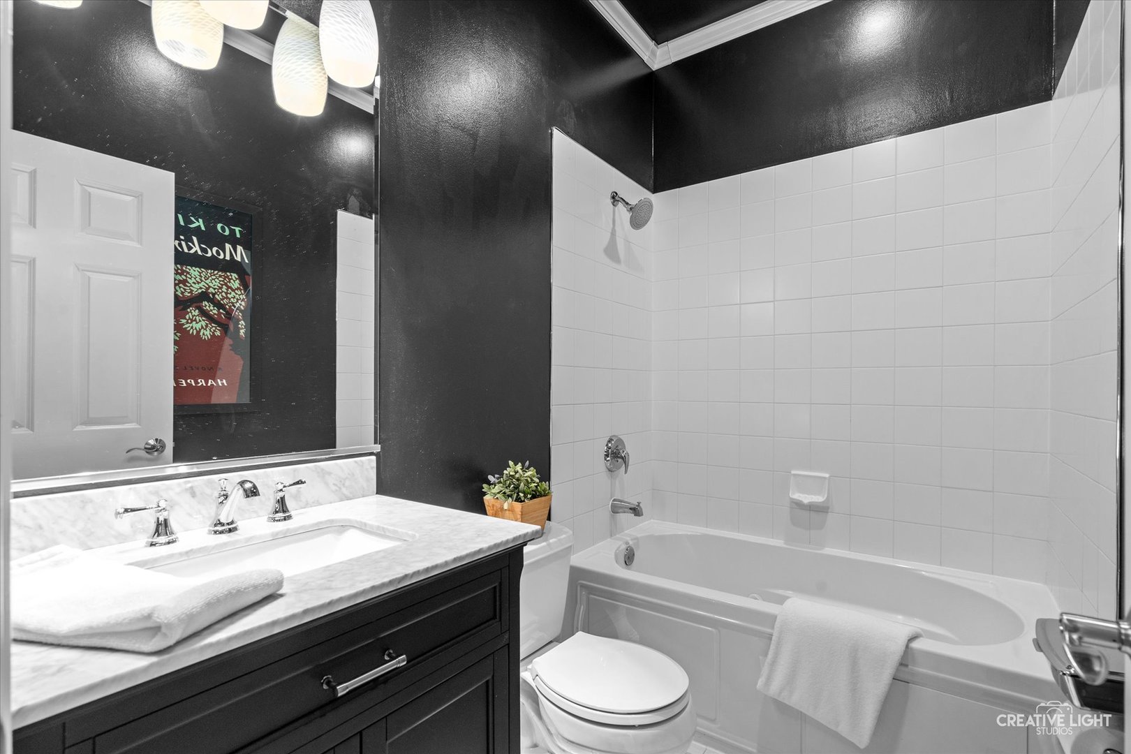 394 Broadmoor Lane Bartlett, IL 60103 - Photo 13 of 18 a bathroom with a granite countertop sink vanity mirror bathtub shower and a toilet