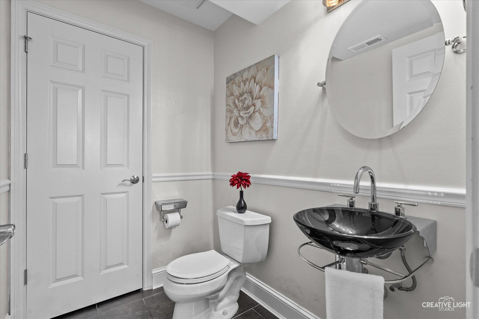 394 Broadmoor Lane Bartlett, IL 60103 - Photo 16 of 18 a bathroom with a toilet a sink and mirror
