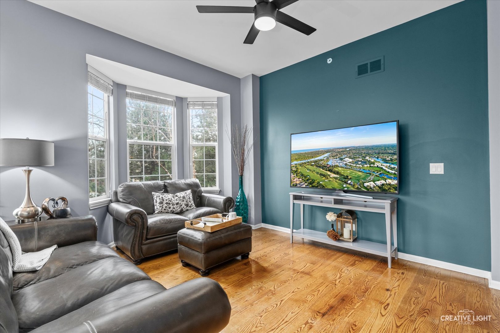 394 Broadmoor Lane Bartlett, IL 60103 - Photo 5 of 18 a living room with furniture and a flat screen tv