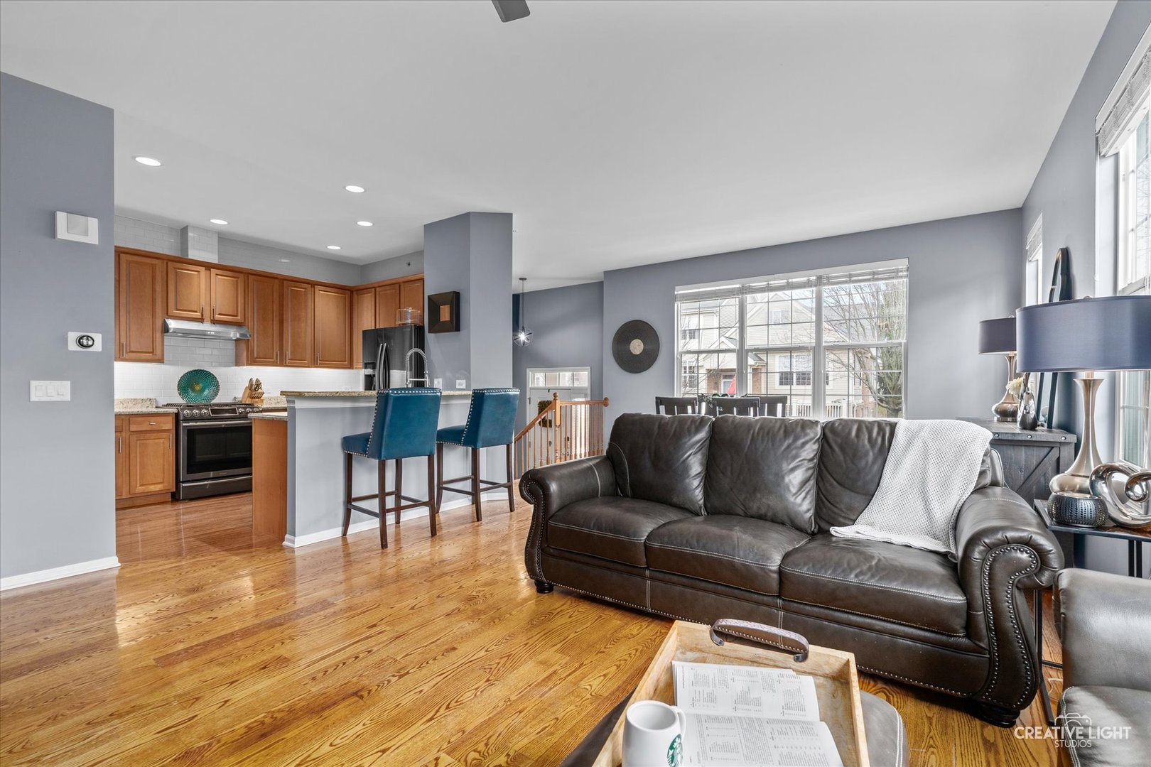 394 Broadmoor Lane Bartlett, IL 60103 - Photo 6 of 18 a living room with furniture and a wooden floor