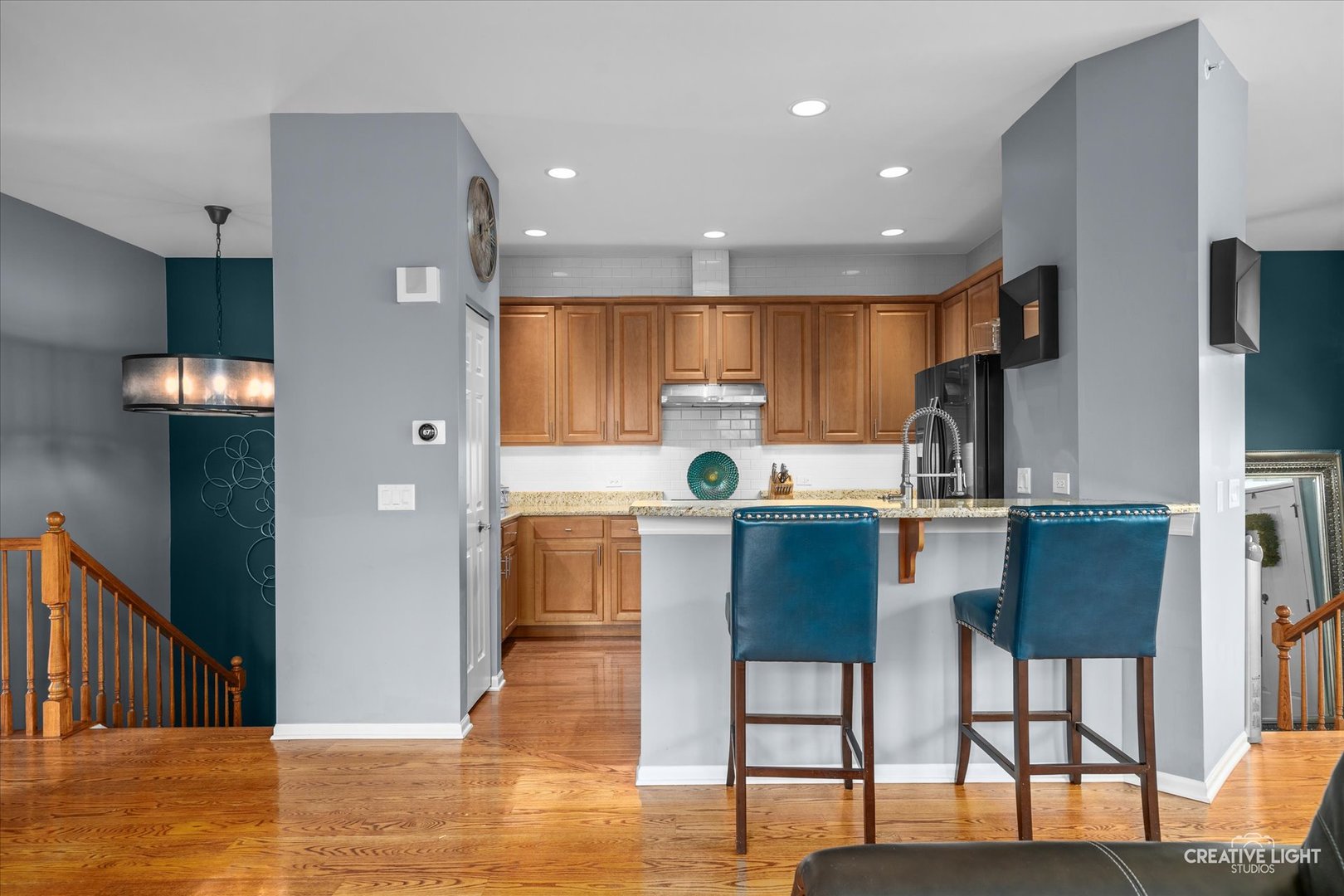 394 Broadmoor Lane Bartlett, IL 60103 - Photo 7 of 18 a kitchen with stainless steel appliances granite countertop a refrigerator and a stove top oven