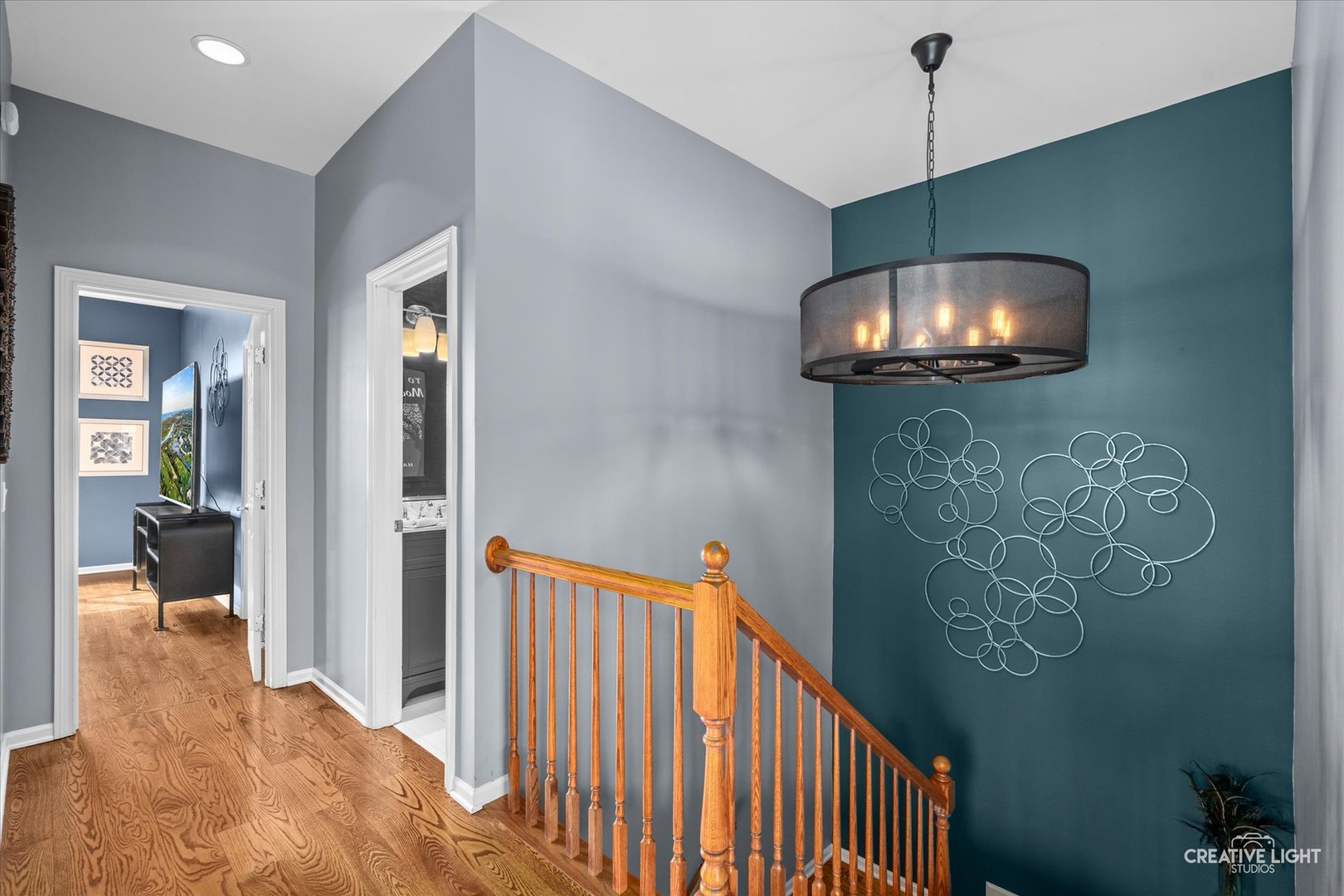 394 Broadmoor Lane Bartlett, IL 60103 - Photo 9 of 18 a view of a hallway to a livingroom and a chandelier fan