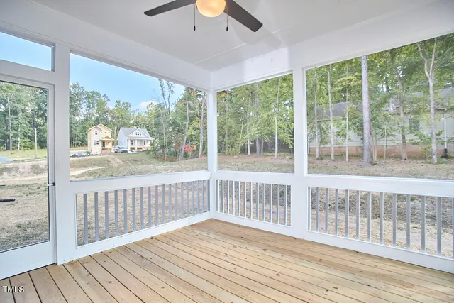 a view of a balcony with wooden floor