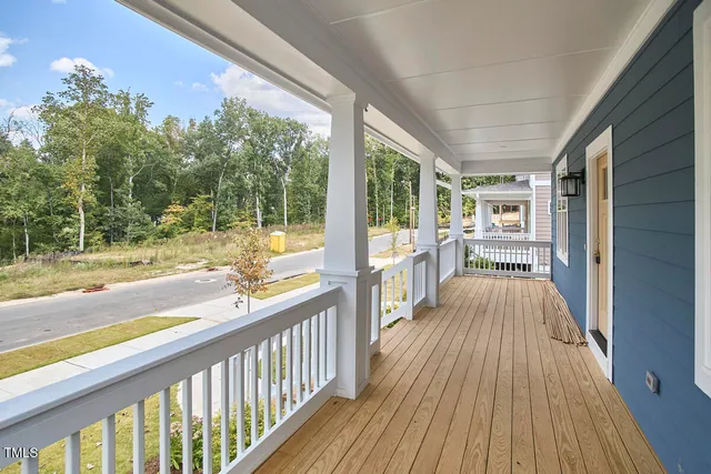 a view of balcony with wooden floor and outdoor space
