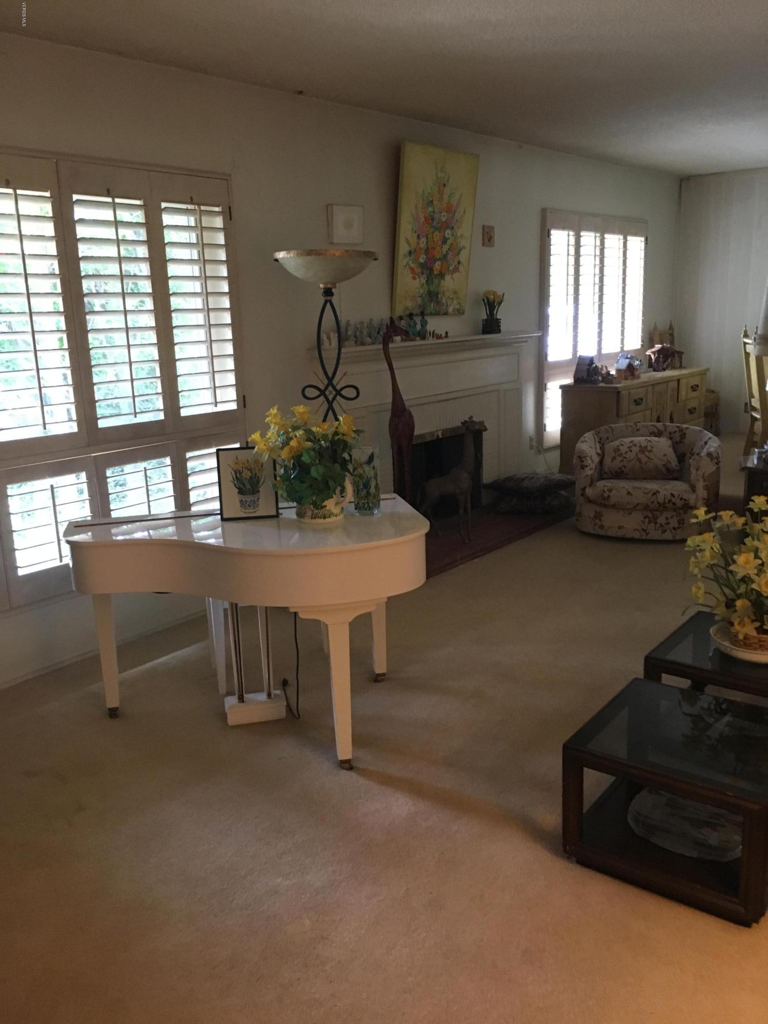 1065 Warwick Avenue Thousand Oaks, CA 91360 - Photo 3 of 15 a living room with furniture and a fireplace