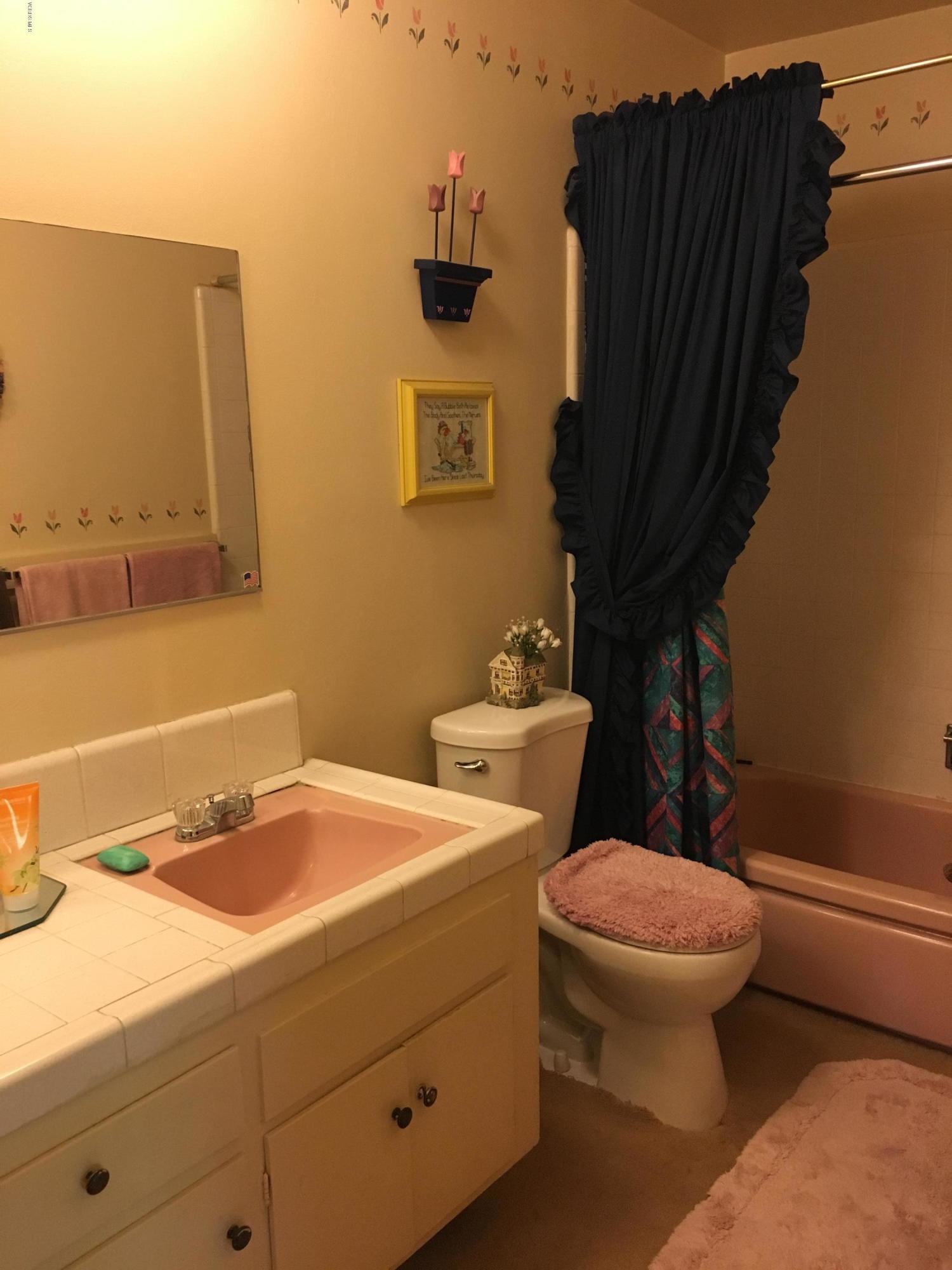 1065 Warwick Avenue Thousand Oaks, CA 91360 - Photo 6 of 15 a bathroom with a sink a toilet and a mirror