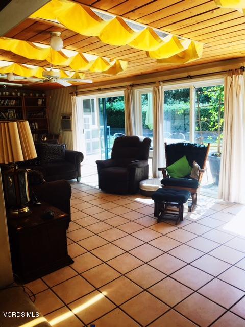 1065 Warwick Avenue Thousand Oaks, CA 91360 - Photo 8 of 15 a living room with furniture and a large window