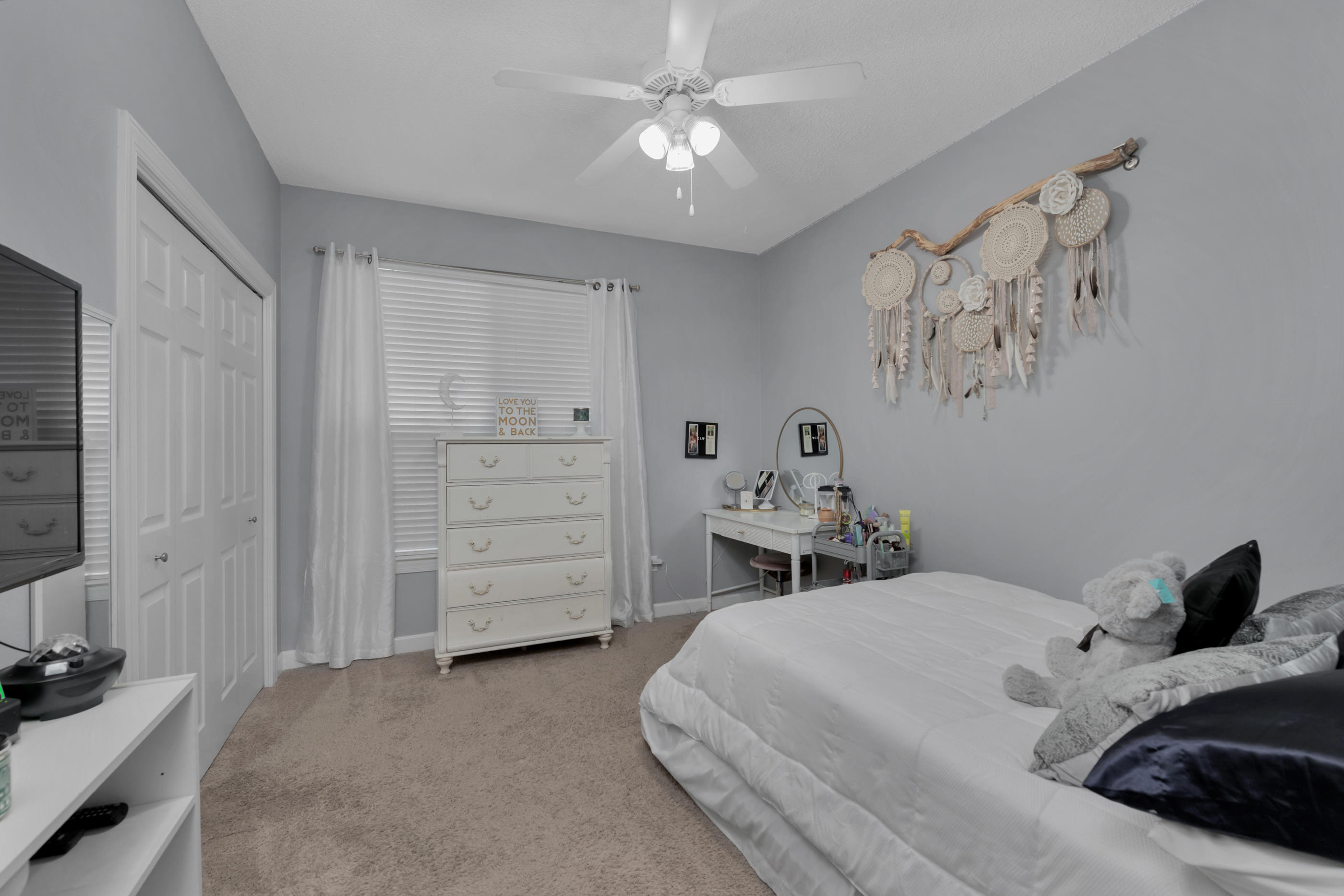 4061 Drifting Sand Trail Destin, FL 32541 - Photo 12 of 32 a bedroom with a bed and a chandelier