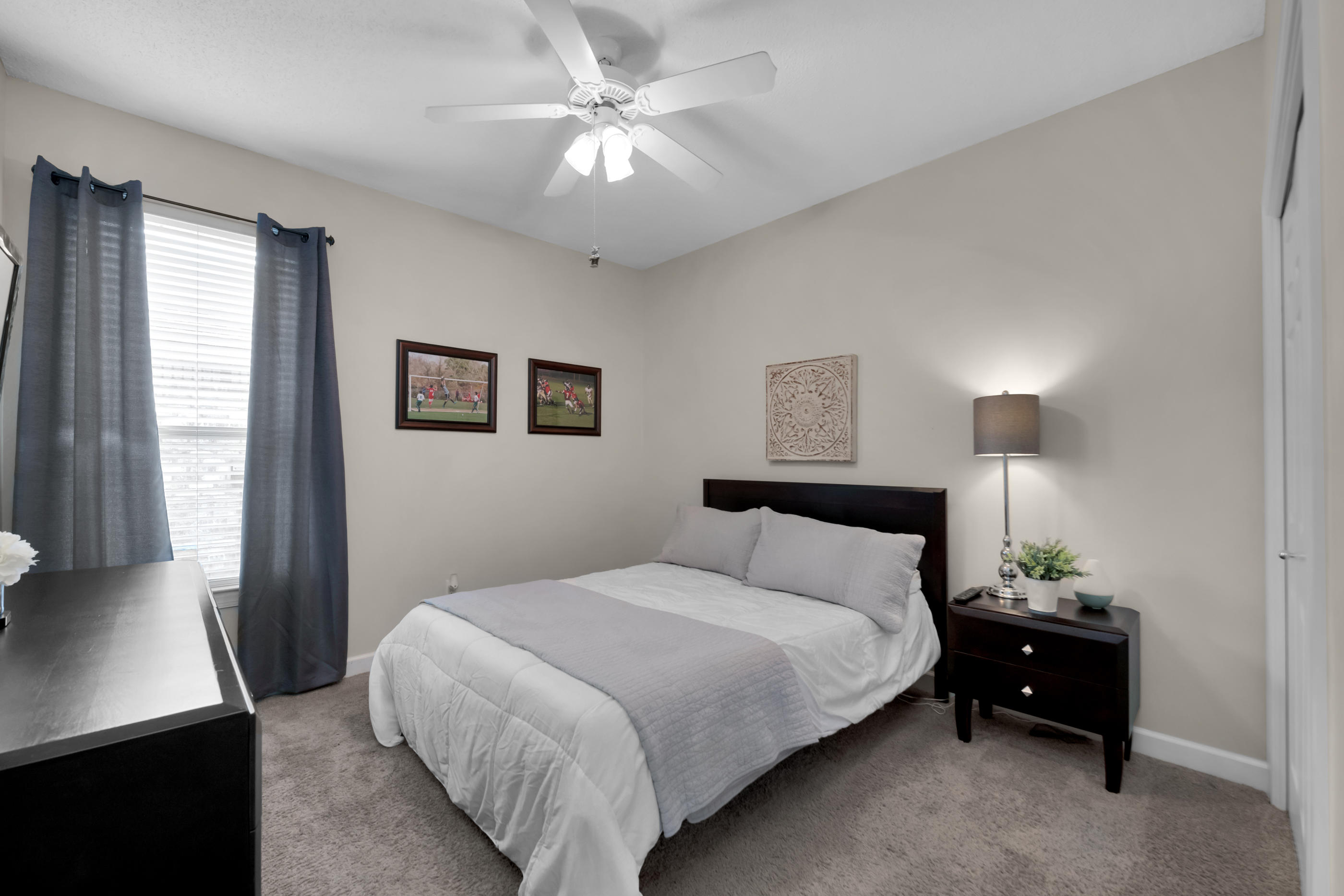 4061 Drifting Sand Trail Destin, FL 32541 - Photo 14 of 32 a bedroom with a bed and a night stand