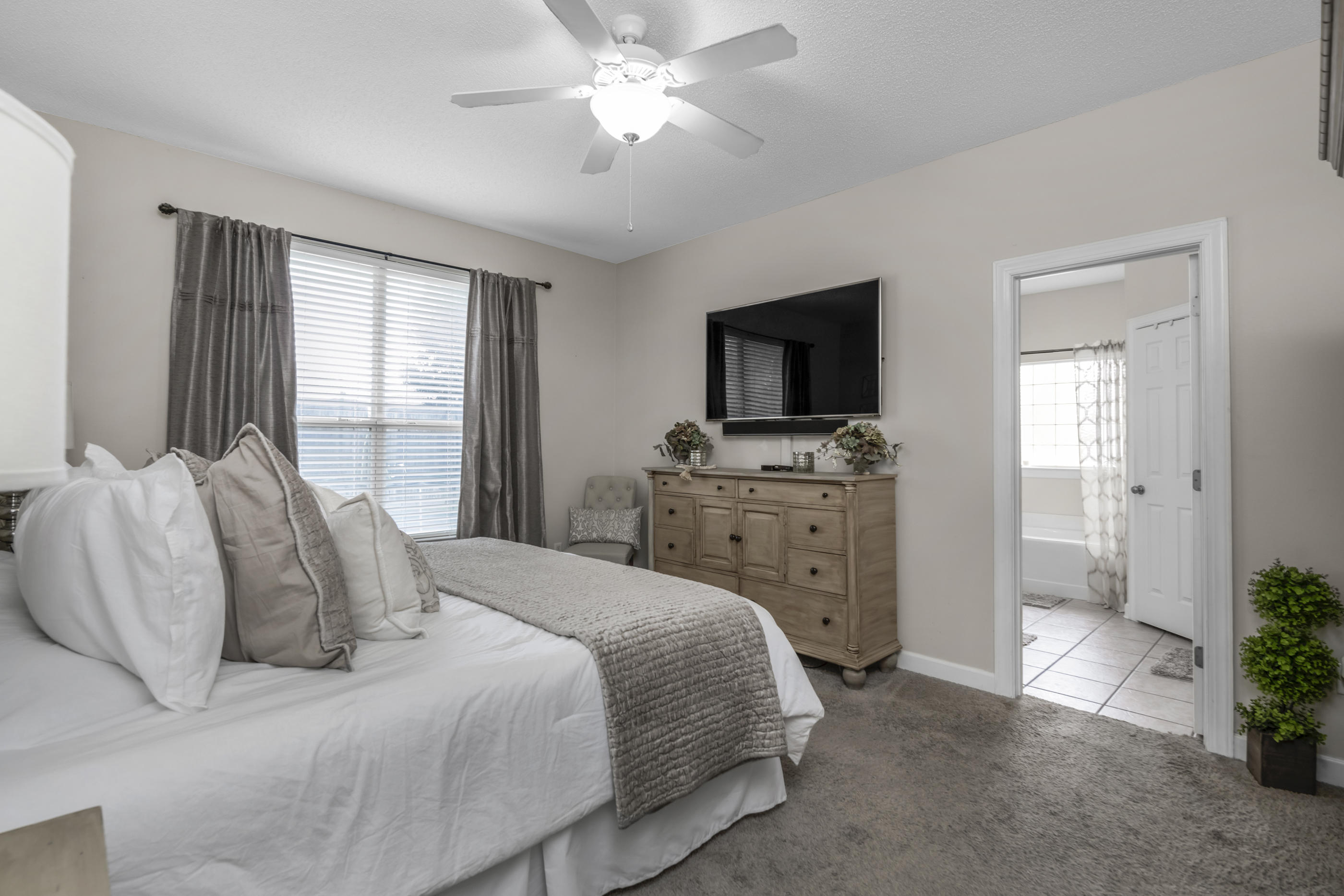 4061 Drifting Sand Trail Destin, FL 32541 - Photo 15 of 32 a bedroom with a bed and a television