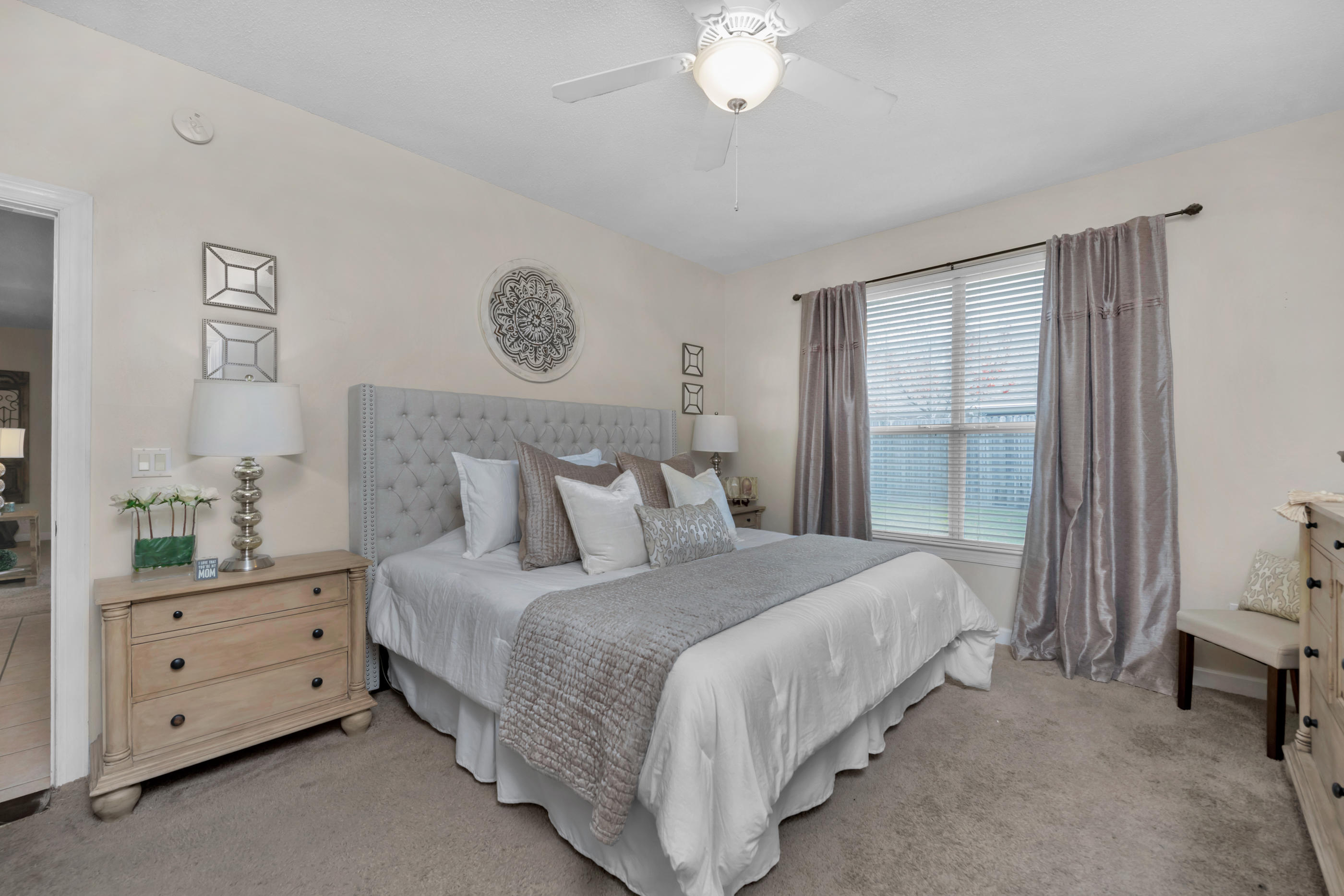 4061 Drifting Sand Trail Destin, FL 32541 - Photo 16 of 32 a bedroom with a bed and a chandelier