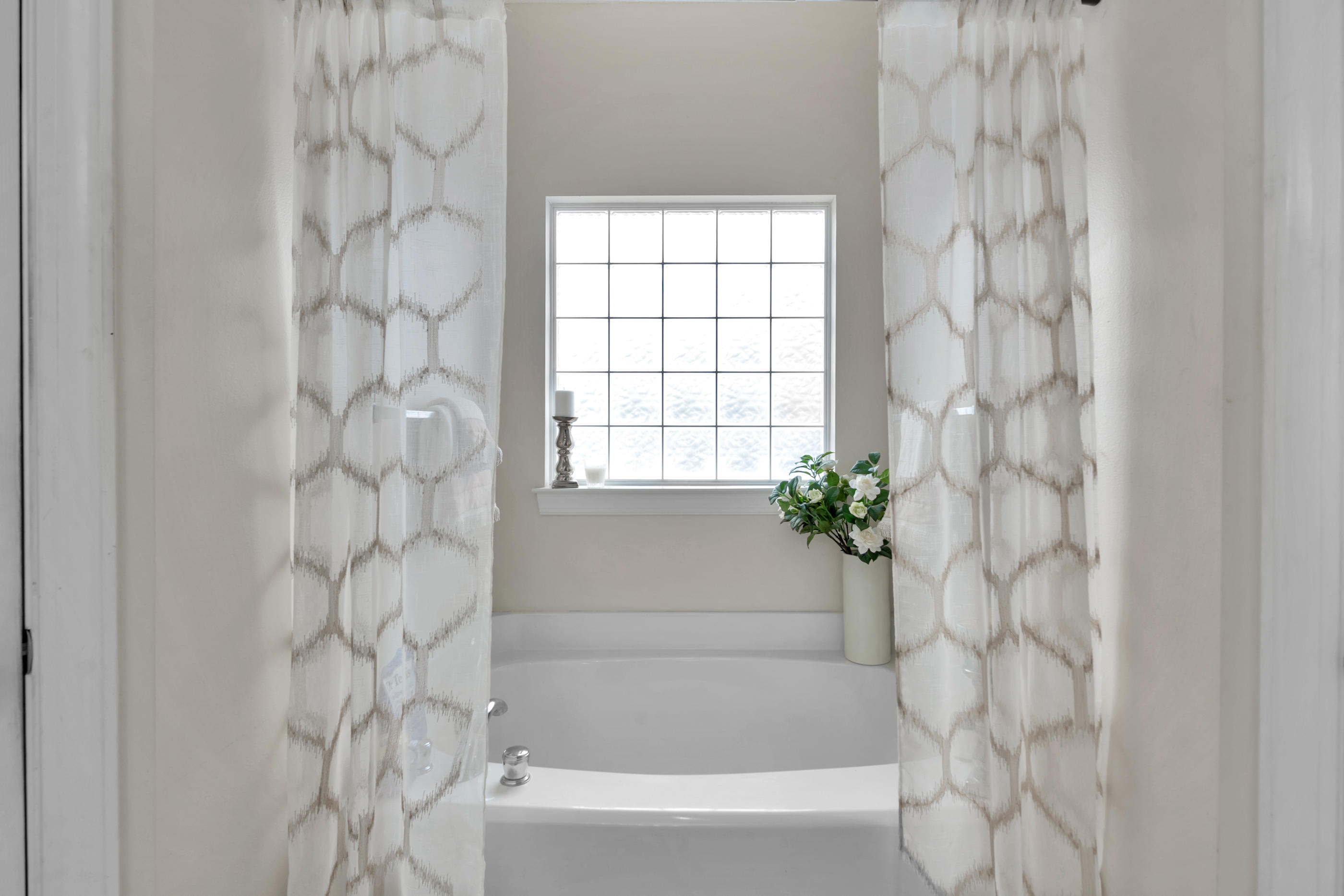 4061 Drifting Sand Trail Destin, FL 32541 - Photo 19 of 32 a bathroom with a bathtub and shower