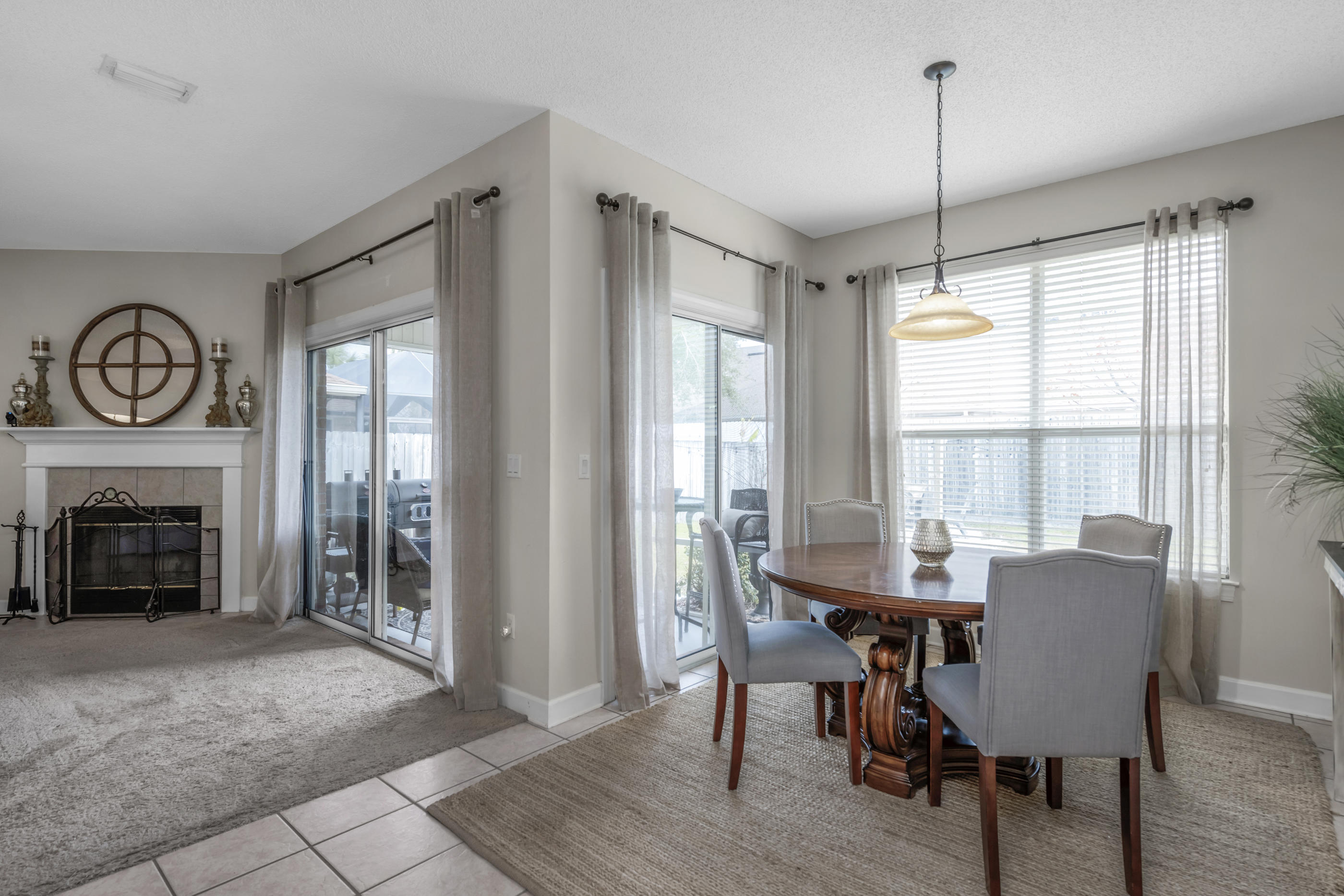 4061 Drifting Sand Trail Destin, FL 32541 - Photo 20 of 32 a view of a dining room with furniture window and wooden floor