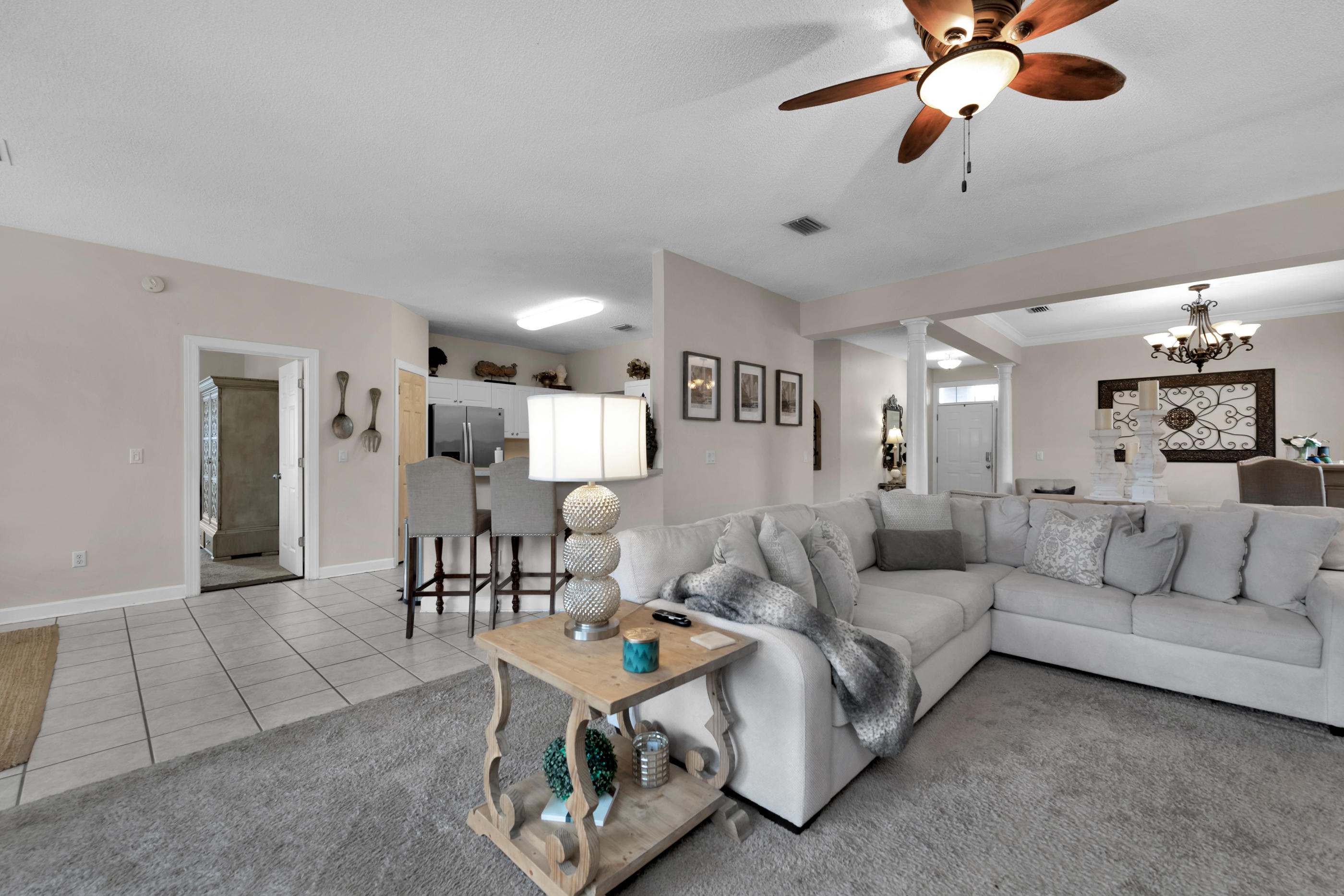 4061 Drifting Sand Trail Destin, FL 32541 - Photo 21 of 32 a living room with furniture and a chandelier