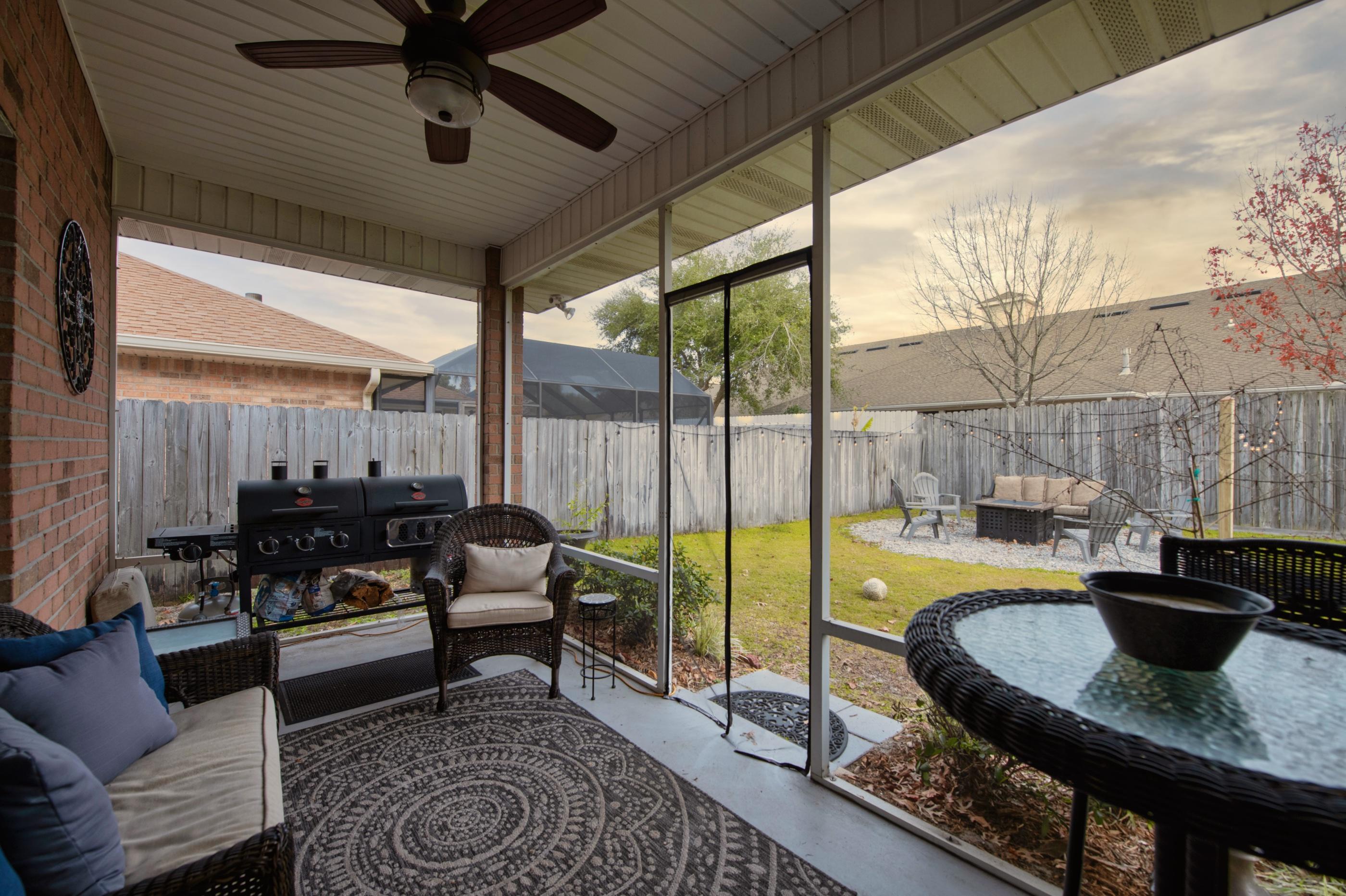 4061 Drifting Sand Trail Destin, FL 32541 - Photo 26 of 32 a living room with furniture and a floor to ceiling window