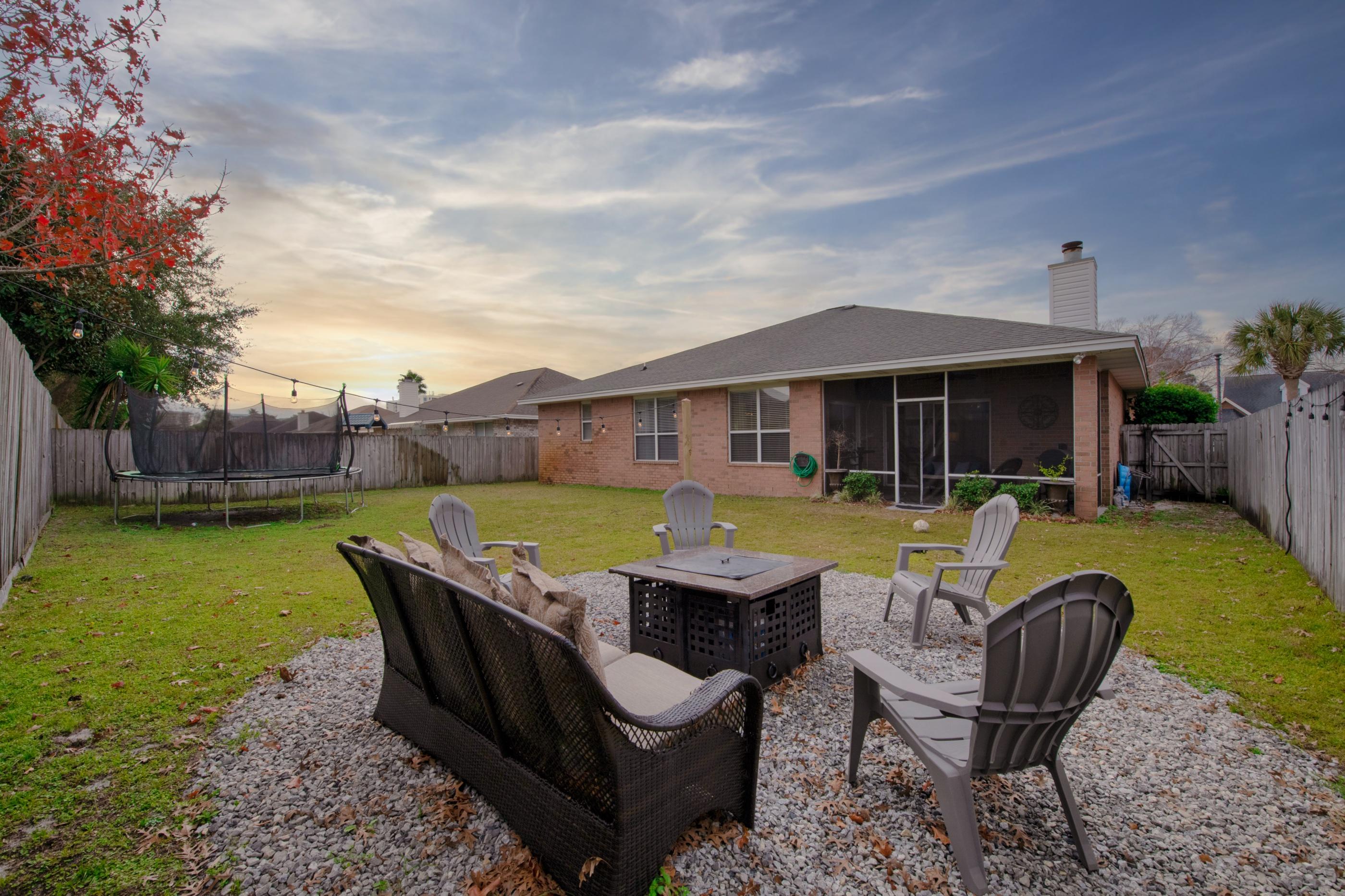 4061 Drifting Sand Trail Destin, FL 32541 - Photo 29 of 32 a view of a house with backyard sitting area and swimming pool