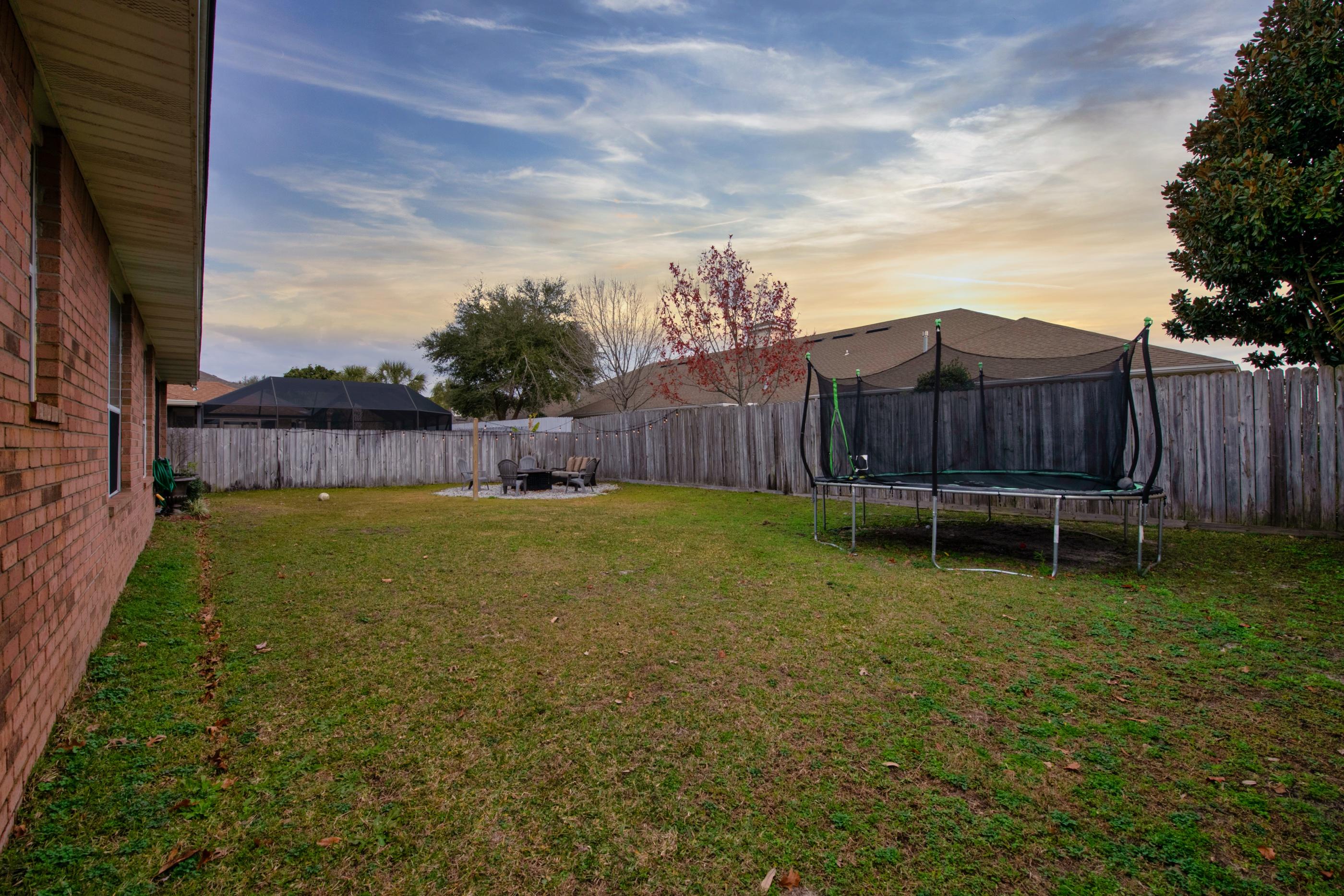 4061 Drifting Sand Trail Destin, FL 32541 - Photo 30 of 32 a view of a backyard with a fence