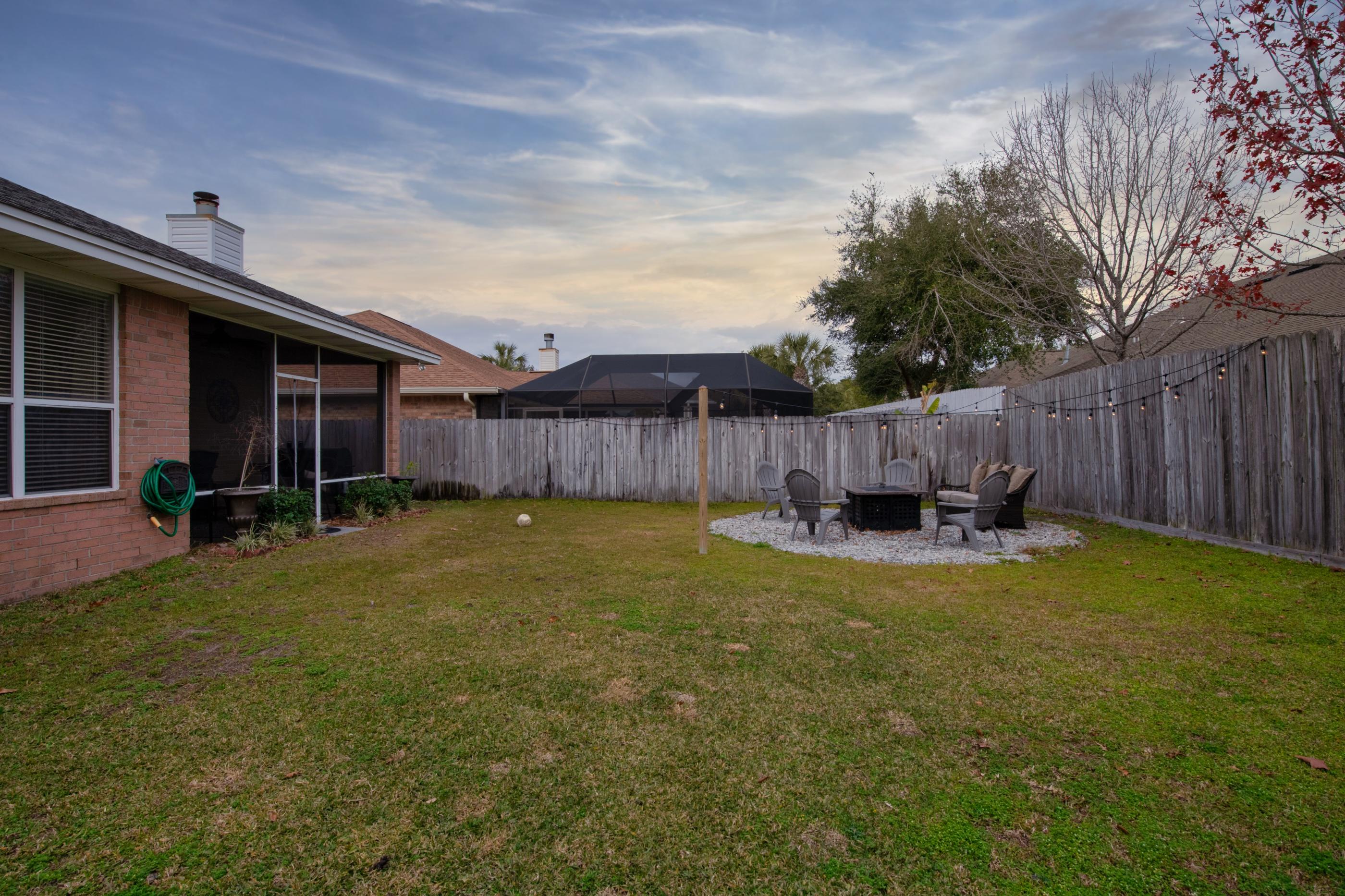 4061 Drifting Sand Trail Destin, FL 32541 - Photo 31 of 32 a view of a backyard with swimming pool and furniture
