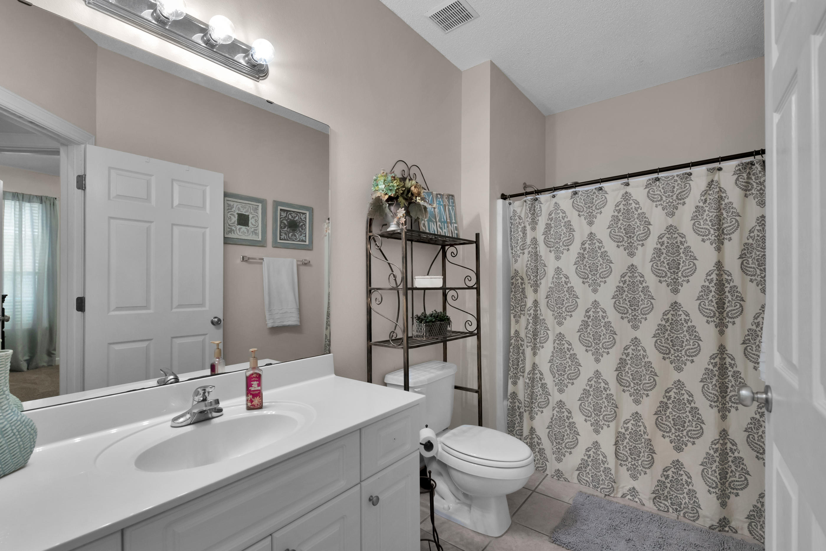 4061 Drifting Sand Trail Destin, FL 32541 - Photo 10 of 32 a bathroom with a sink toilet and shower