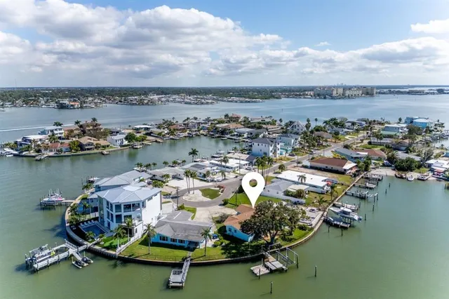 an aerial view of a ocean with boats