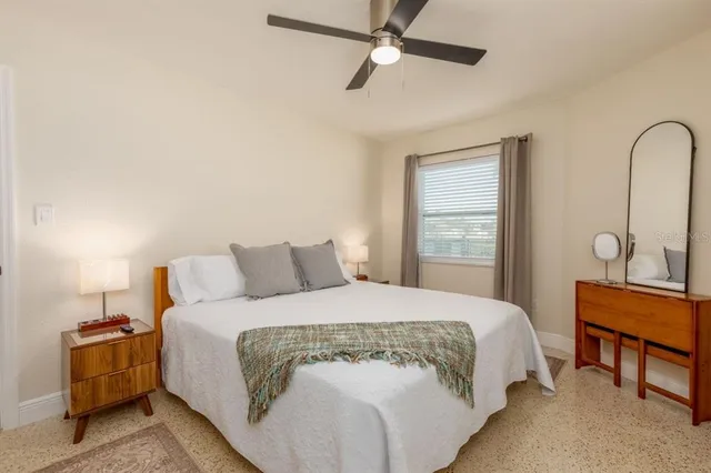 a bathroom with a sink toilet and window