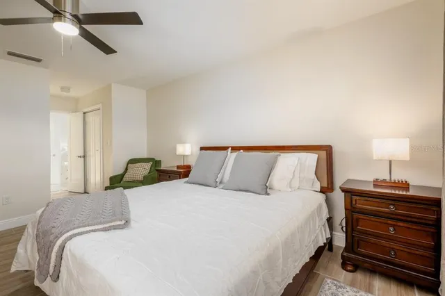 a view of a house with a yard and tree