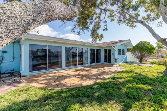 an aerial view of a houses with a lake view