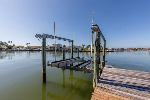 a view of a lake with boats and a bridge