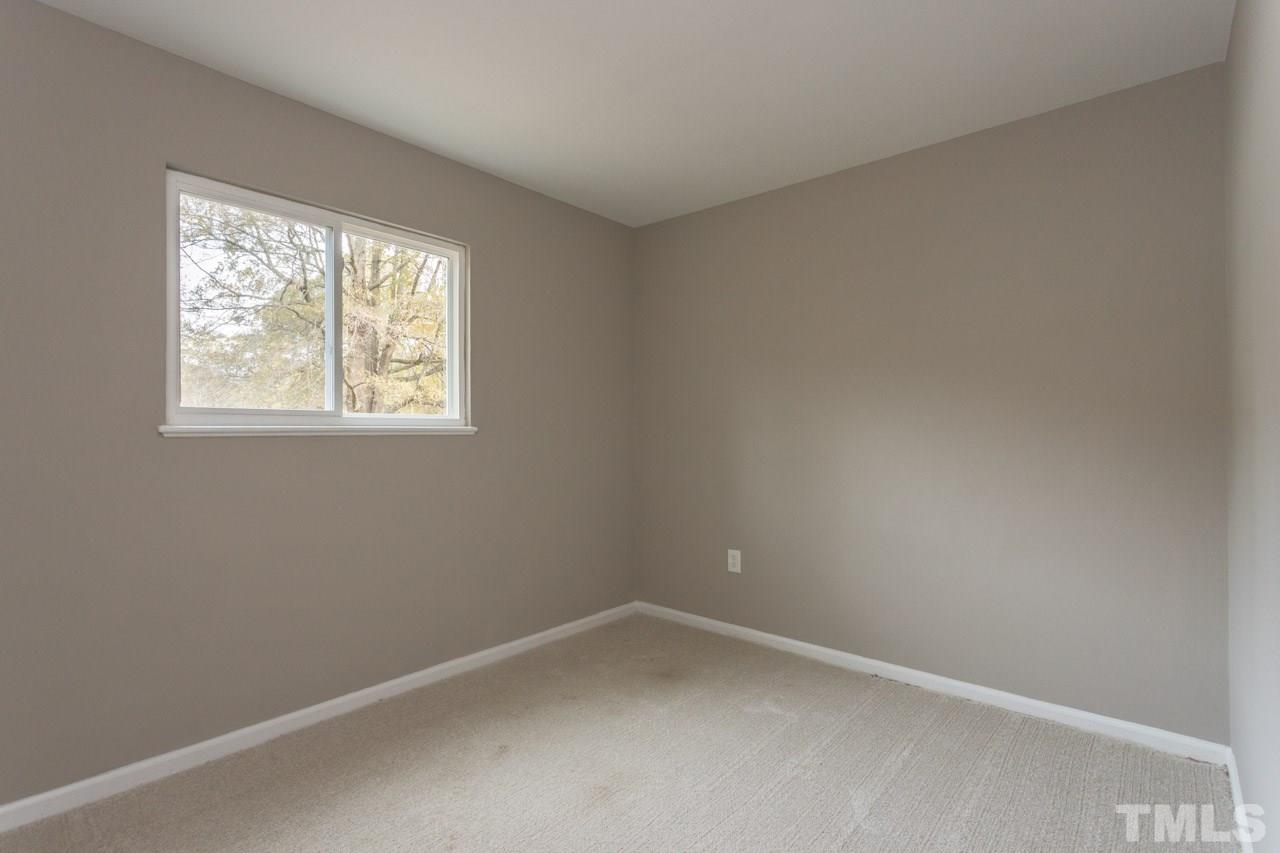 2708 Sanderford Road Raleigh, NC 27610 - Photo 13 of 21 an empty room with a window