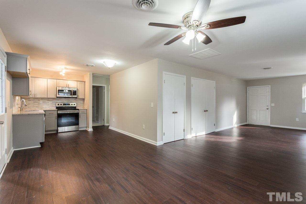 2708 Sanderford Road Raleigh, NC 27610 - Photo 4 of 21 a view of an empty room with kitchen and kitchen view