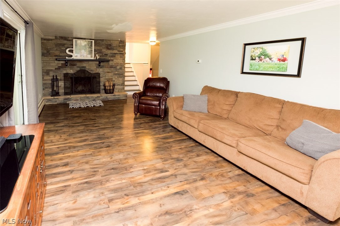 928 Upton Road Youngstown, OH 44509 - Photo 20 of 34 Beautiful family room in lower level with stone fireplace and slider to covered porch.