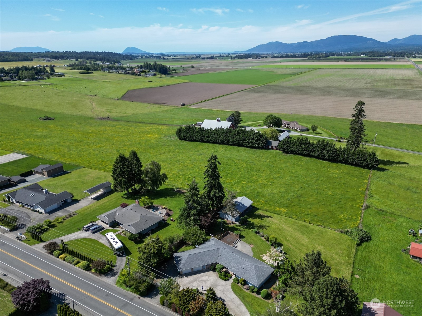 16925 Peterson Road Burlington, WA 98233 - Photo 4 of 36 an aerial view of green landscape with outdoor space swimming pool